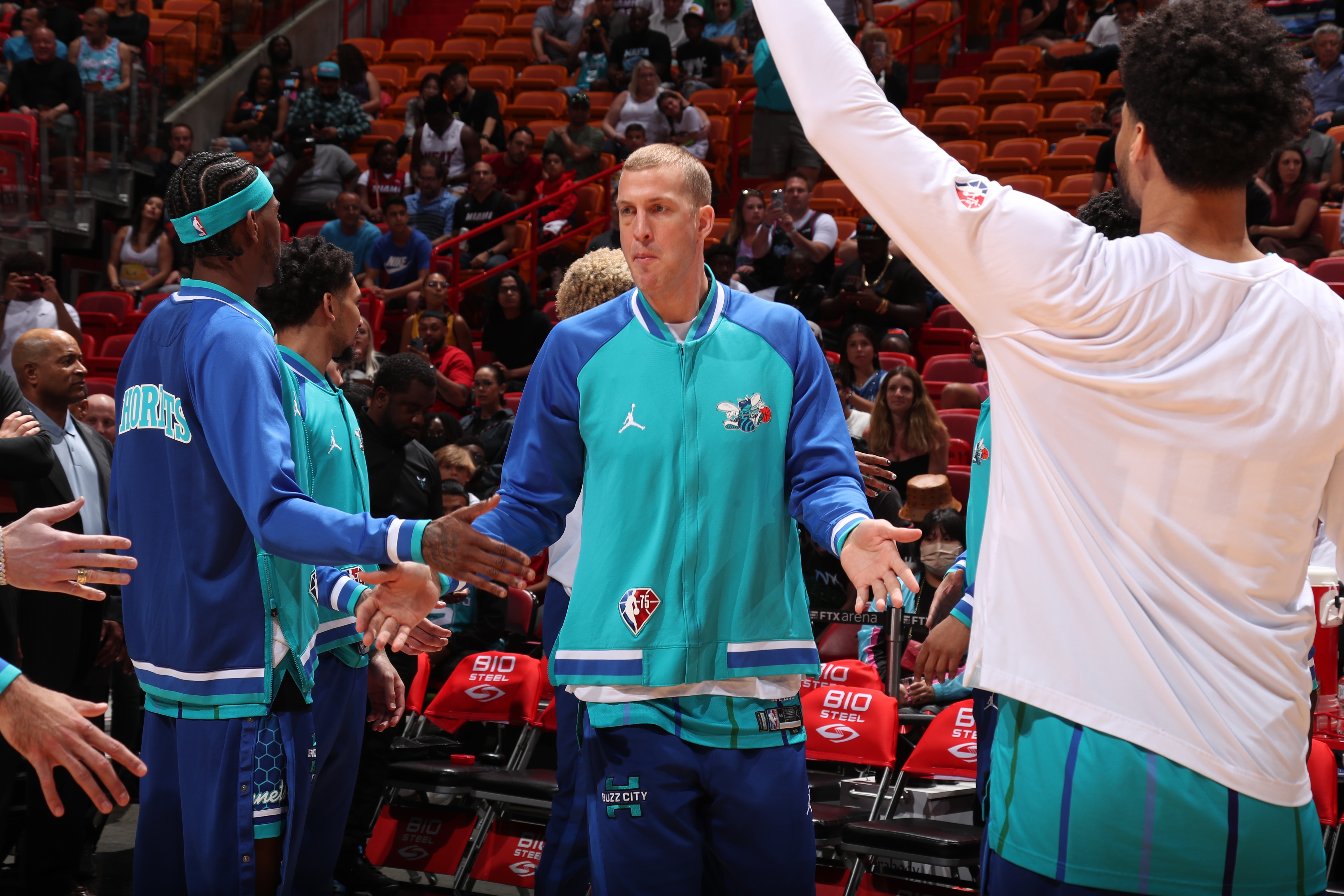 MIAMI, FL - APRIL 5: Mason Plumlee #24 of the Charlotte Hornets high fives teammates before the game against the Miami Heat on April 5, 2022 at FTX Arena in Miami, Florida. NOTE TO USER: User expressly acknowledges and agrees that, by downloading and or using this Photograph, user is consenting to the terms and conditions of the Getty Images License Agreement. Mandatory Copyright Notice: Copyright 2022 NBAE (Photo by Issac Baldizon/NBAE via Getty Images)