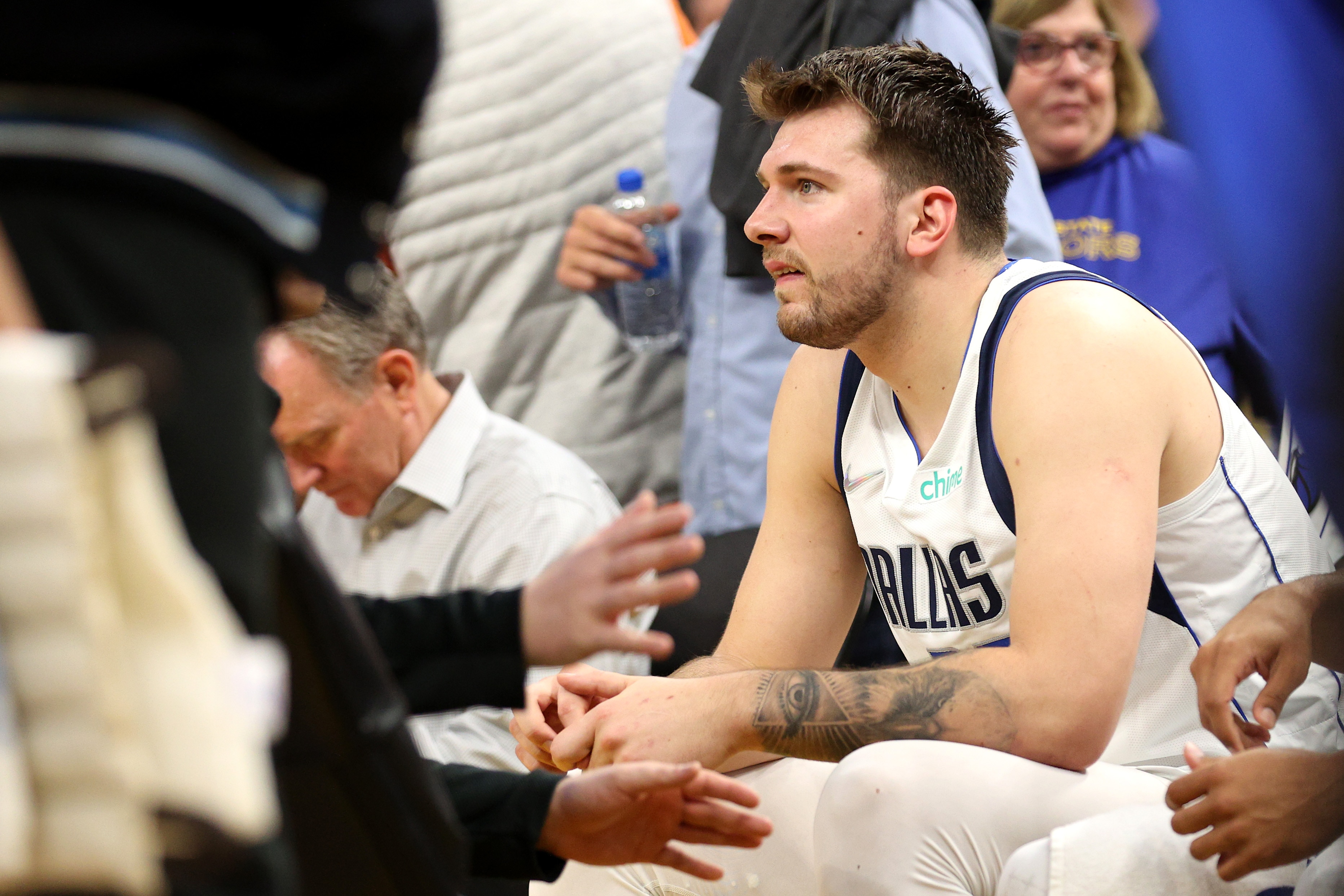 SAN FRANCISCO, CALIFORNIA - MAY 26: Luka Doncic #77 of the Dallas Mavericks looks on from the bench during a timeout during the third quarter against the Golden State Warriors in Game Five of the 2022 NBA Playoffs Western Conference Finals at Chase Center on May 26, 2022 in San Francisco, California. NOTE TO USER: User expressly acknowledges and agrees that, by downloading and or using this photograph, User is consenting to the terms and conditions of the Getty Images License Agreement. (Photo by Ezra Shaw/Getty Images)