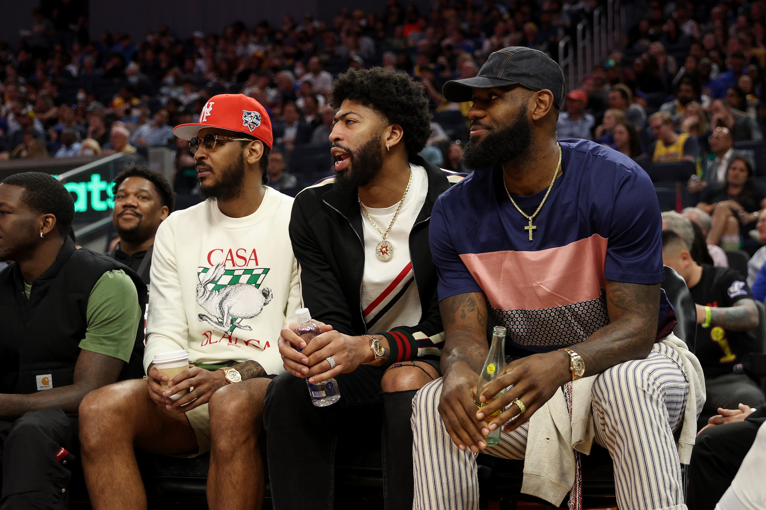 SAN FRANCISCO, CALIFORNIA - APRIL 07: (L-R) Carmelo Anthony #7, Anthony Davis #3, and LeBron James #6 of the Los Angeles Lakers sit on the bench during their game against the Golden State Warriors in the second half at Chase Center on April 07, 2022 in San Francisco, California. NOTE TO USER: User expressly acknowledges and agrees that, by downloading and/or using this photograph, User is consenting to the terms and conditions of the Getty Images License Agreement. (Photo by Ezra Shaw/Getty Images) SAN FRANCISCO, CALIFORNIA - APRIL 07: (L-R) Carmelo Anthony #7, Anthony Davis #3, and LeBron James #6 of the Los Angeles Lakers sit on the bench during their game against the Golden State Warriors in the second half at Chase Center on April 07, 2022 in San Francisco, California. NOTE TO USER: User expressly acknowledges and agrees that, by downloading and/or using this photograph, User is consenting to the terms and conditions of the Getty Images License Agreement. (Photo by Ezra Shaw/Getty Images)