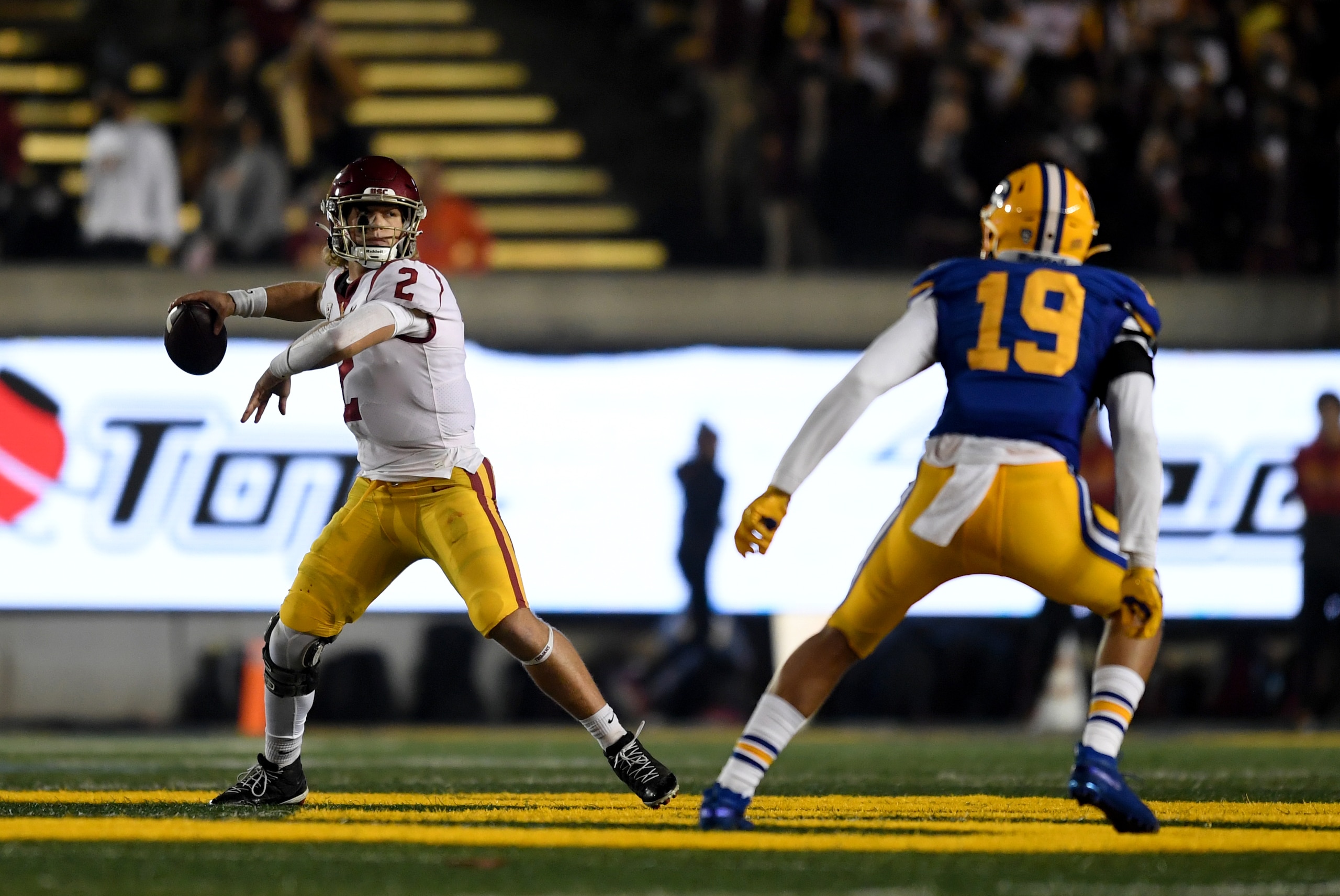 BERKELEY, CALIFORNIA - DECEMBER 04: Quarterback Jaxson Dart #2 of the USC Trojans throws ball under pressure from the California Golden Bears at California Memorial Stadium on December 04, 2021 in Berkeley, California. (Photo by Michael Urakami/Getty Images)