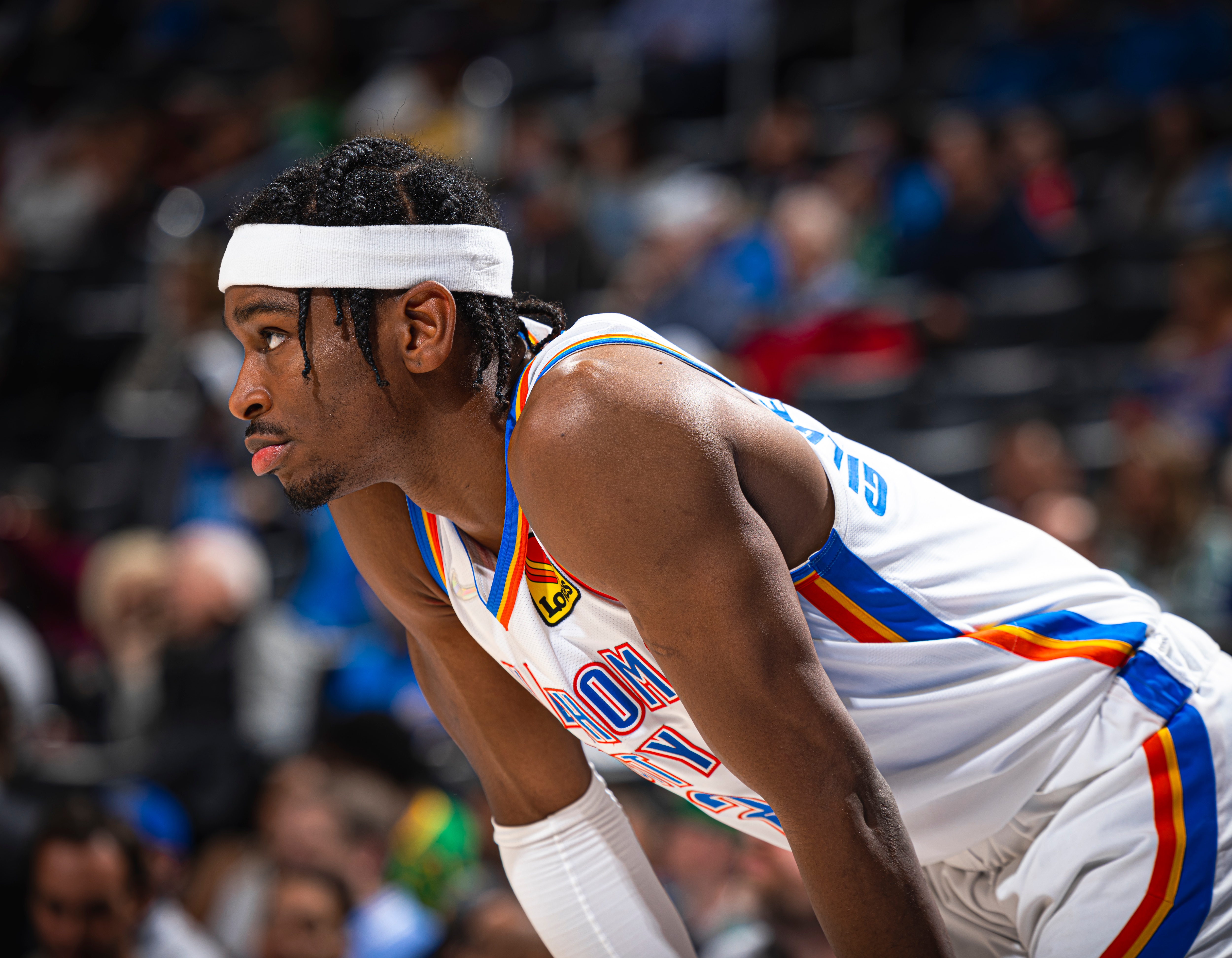OKLAHOMA CITY, OK - MARCH 21: Shai Gilgeous-Alexander #2 of the Oklahoma City Thunder looks on during the game against the Boston Celtics on March 21, 2022 at Paycom Arena in Oklahoma City, Oklahoma. NOTE TO USER: User expressly acknowledges and agrees that, by downloading and or using this photograph, User is consenting to the terms and conditions of the Getty Images License Agreement. Mandatory Copyright Notice: Copyright 2022 NBAE (Photo by Zach Beeker/NBAE via Getty Images)