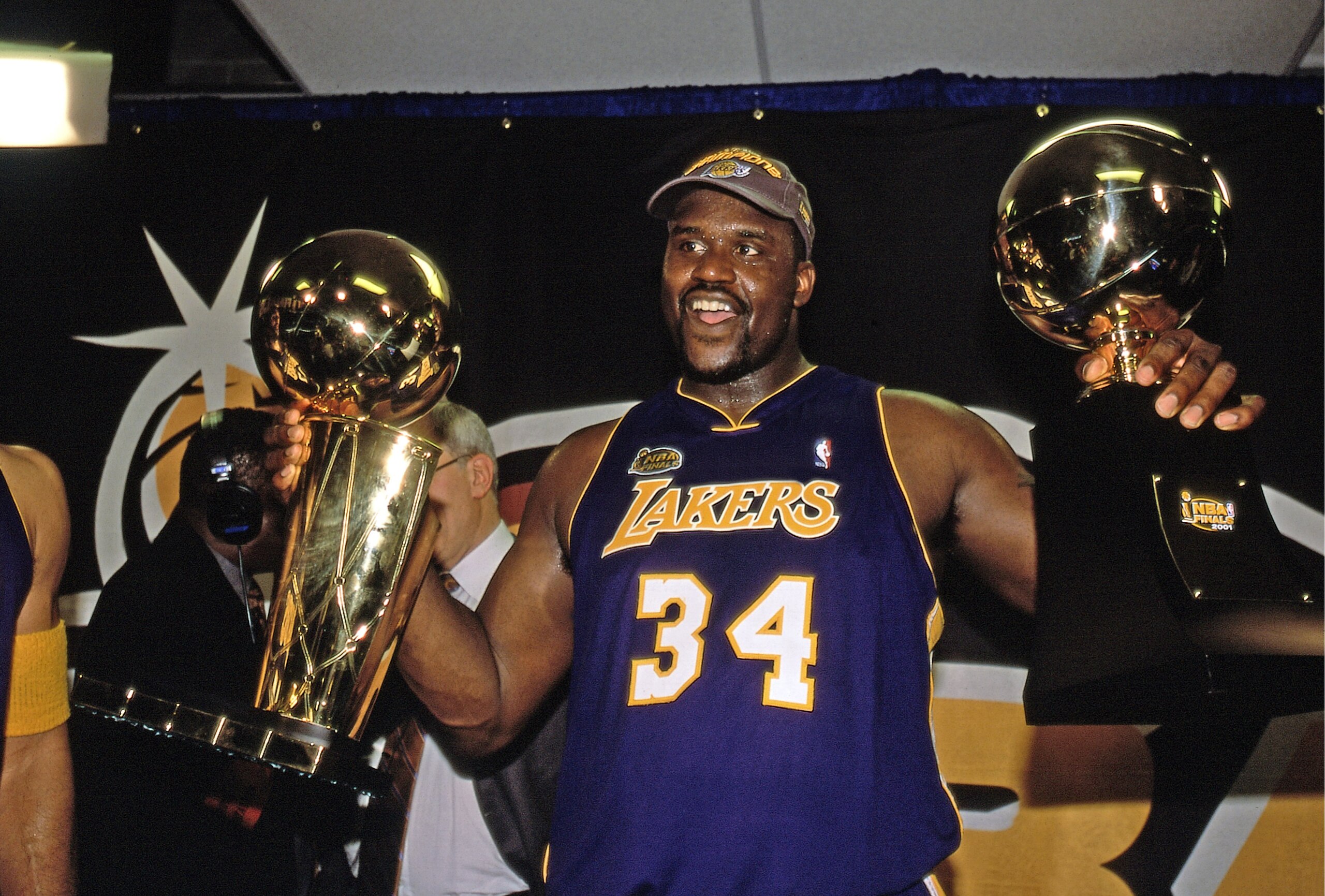 PHILADELPHIA - JUNE 15:  Shaquille O'Neal #34 of the Los Angeles Lakers celebrates with his trophies after winning the 2001 NBA Championship by defeating the Philadelphia 76ers in game five of the NBA FInals June 15, 2001 at the First Union Center in Philadelphia, Pennsylvania.  NOTE TO USER: User expressly acknowledges that, by downloading and or using this photograph, User is consenting to the terms and conditions of the Getty Images License agreement. Mandatory Copyright Notice: Copyright 2001 NBAE (Photo by Nathaniel S. Butler/NBAE via Getty Images)
