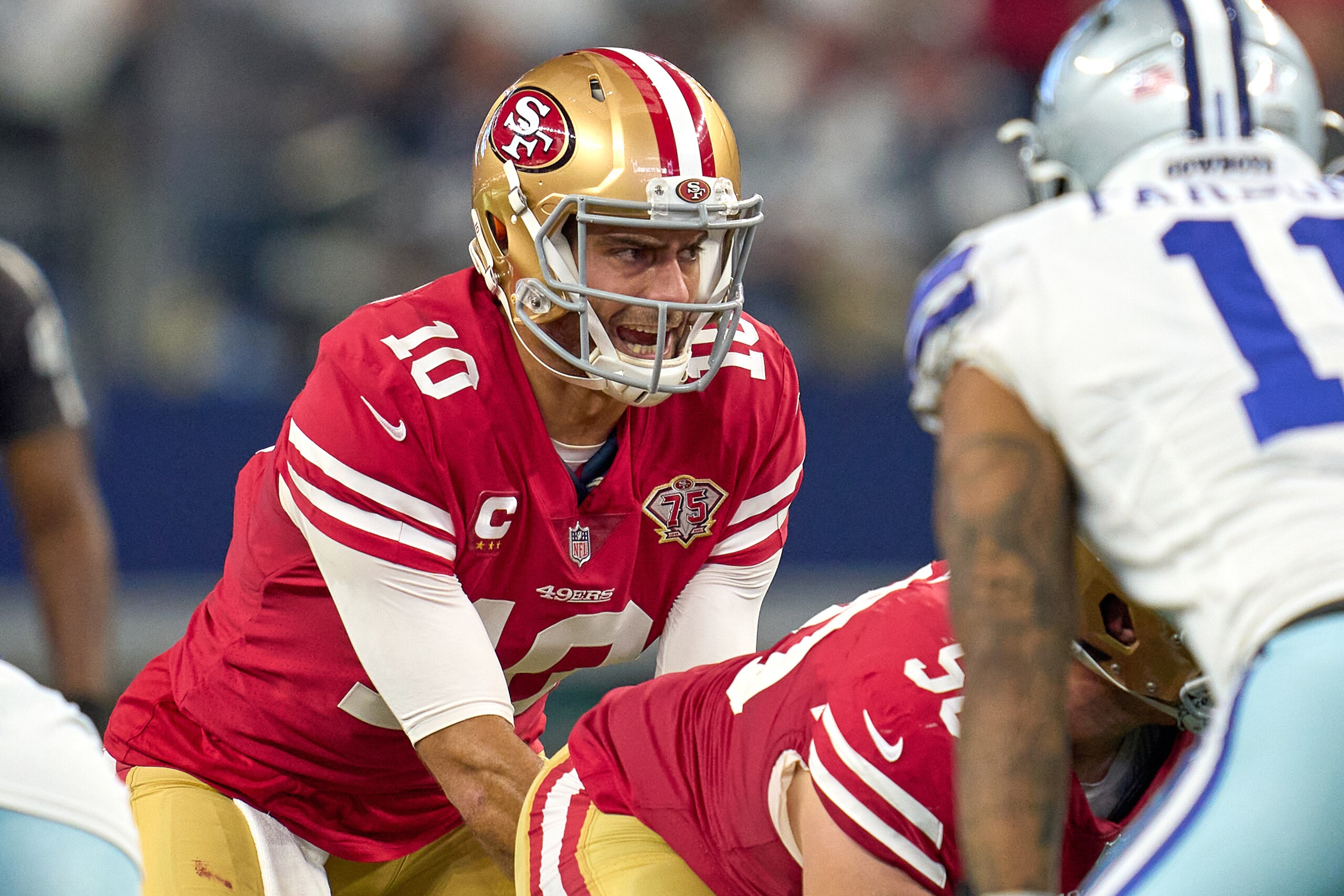 ARLINGTON, TX - JANUARY 16: San Francisco 49ers quarterback Jimmy Garoppolo (10) prepares to take the snap during the NFC Wild Card game between the San Francisco 49ers and the Dallas Cowboys on January 16, 2022 at AT&T Stadium in Arlington, TX. (Photo by Robin Alam/Icon Sportswire via Getty Images)