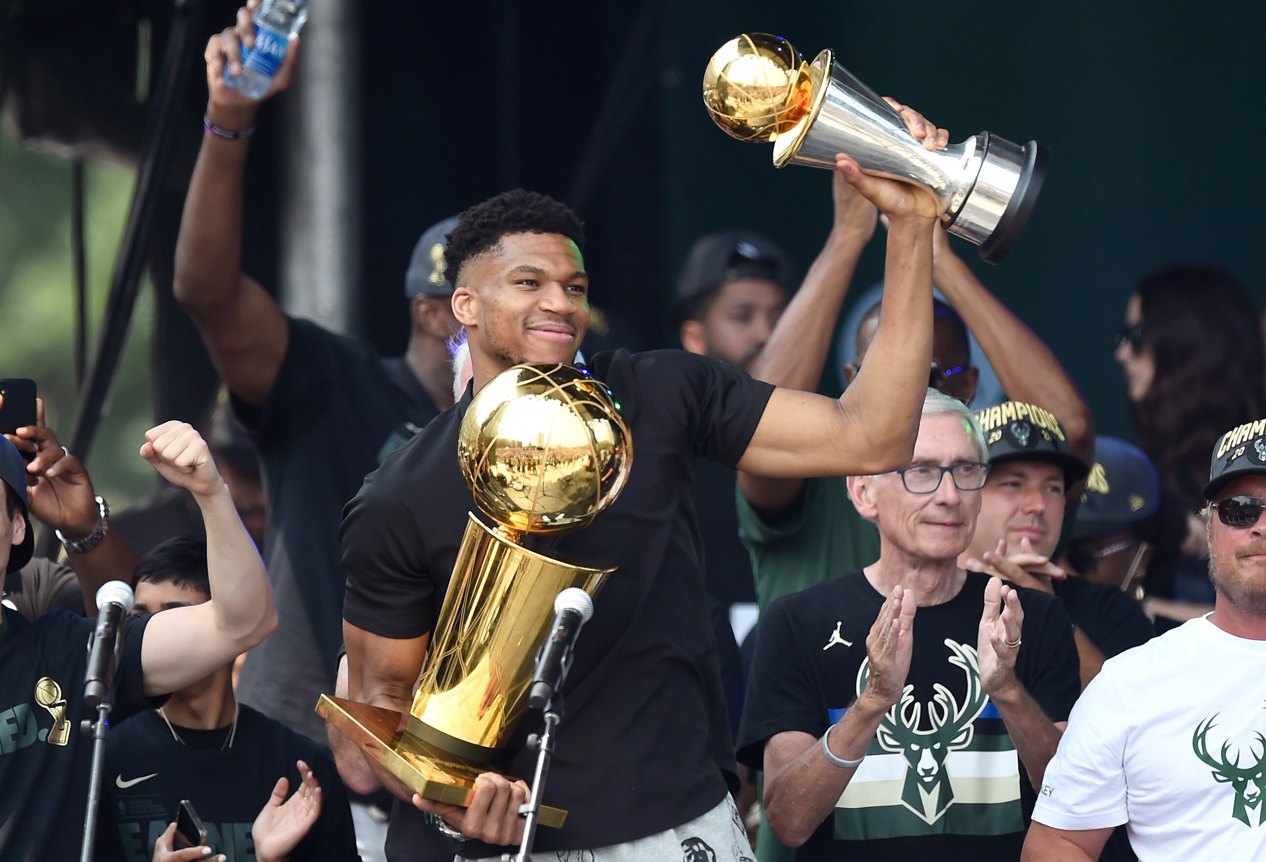 MILWAUKEE, WISCONSIN - JULY 22: Giannis Antetokounmpo celebrates with the Larry O'Brien trophy and Finals MVP trophy during the Milwaukee Bucks 2021 NBA Championship Victory Parade and Rally in the Deer District of Fiserv Forum on July 22, 2021 in Milwaukee, Wisconsin. NOTE TO USER: User expressly acknowledges and agrees that, by downloading and or using this photograph, User is consenting to the terms and conditions of the Getty Images License Agreement. (Photo by Patrick McDermott/Getty Images)