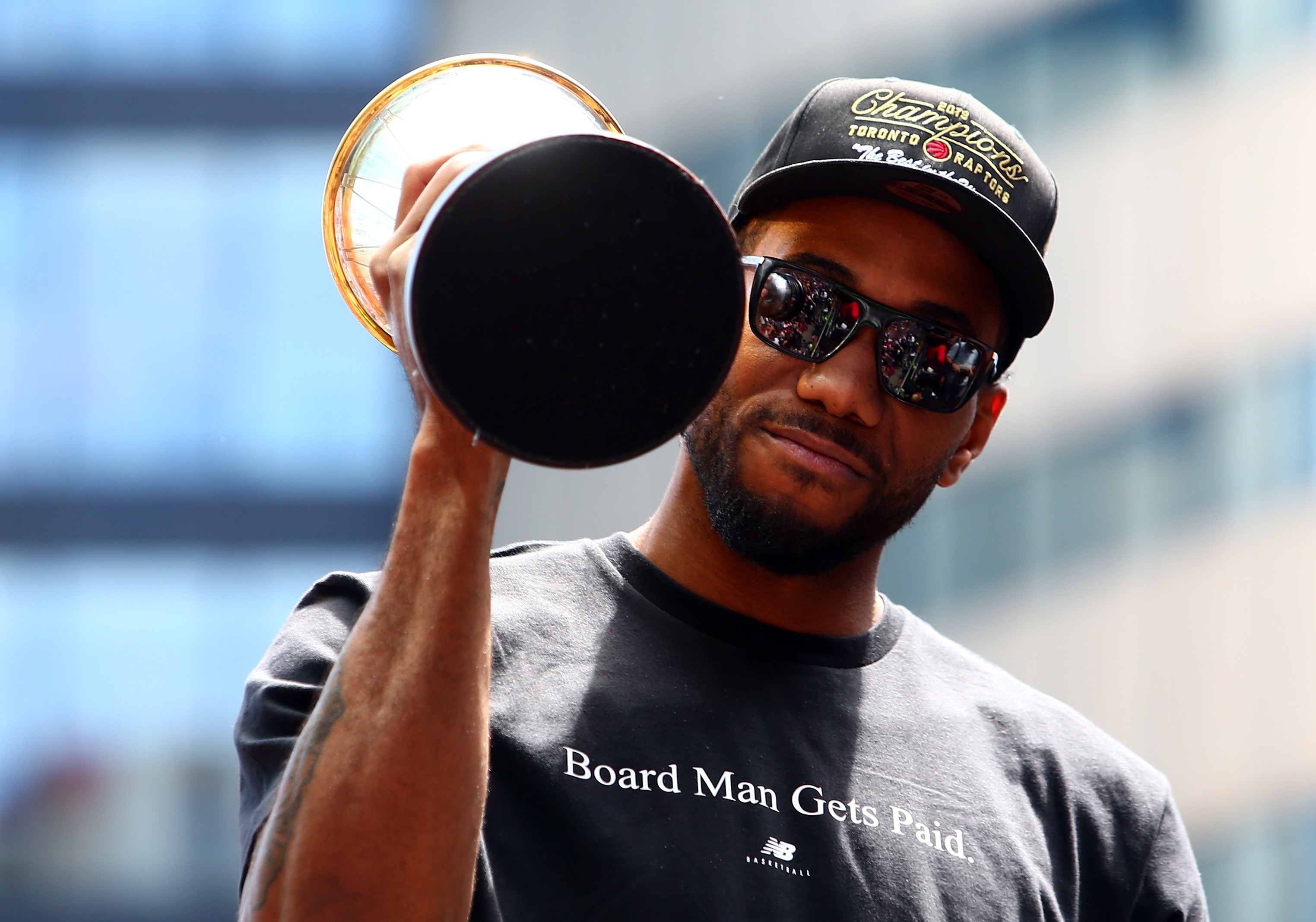 TORONTO, ON - JUNE 17:  Kawhi Leonard #2 of the Toronto Raptors holds the MVP trophy during the Toronto Raptors Victory Parade on June 17, 2019 in Toronto, Canada. The Toronto Raptors beat the Golden State Warriors 4-2 to win the 2019 NBA Finals.  NOTE TO USER: User expressly acknowledges and agrees that, by downloading and or using this photograph, User is consenting to the terms and conditions of the Getty Images License Agreement.  (Photo by Vaughn Ridley/Getty Images)