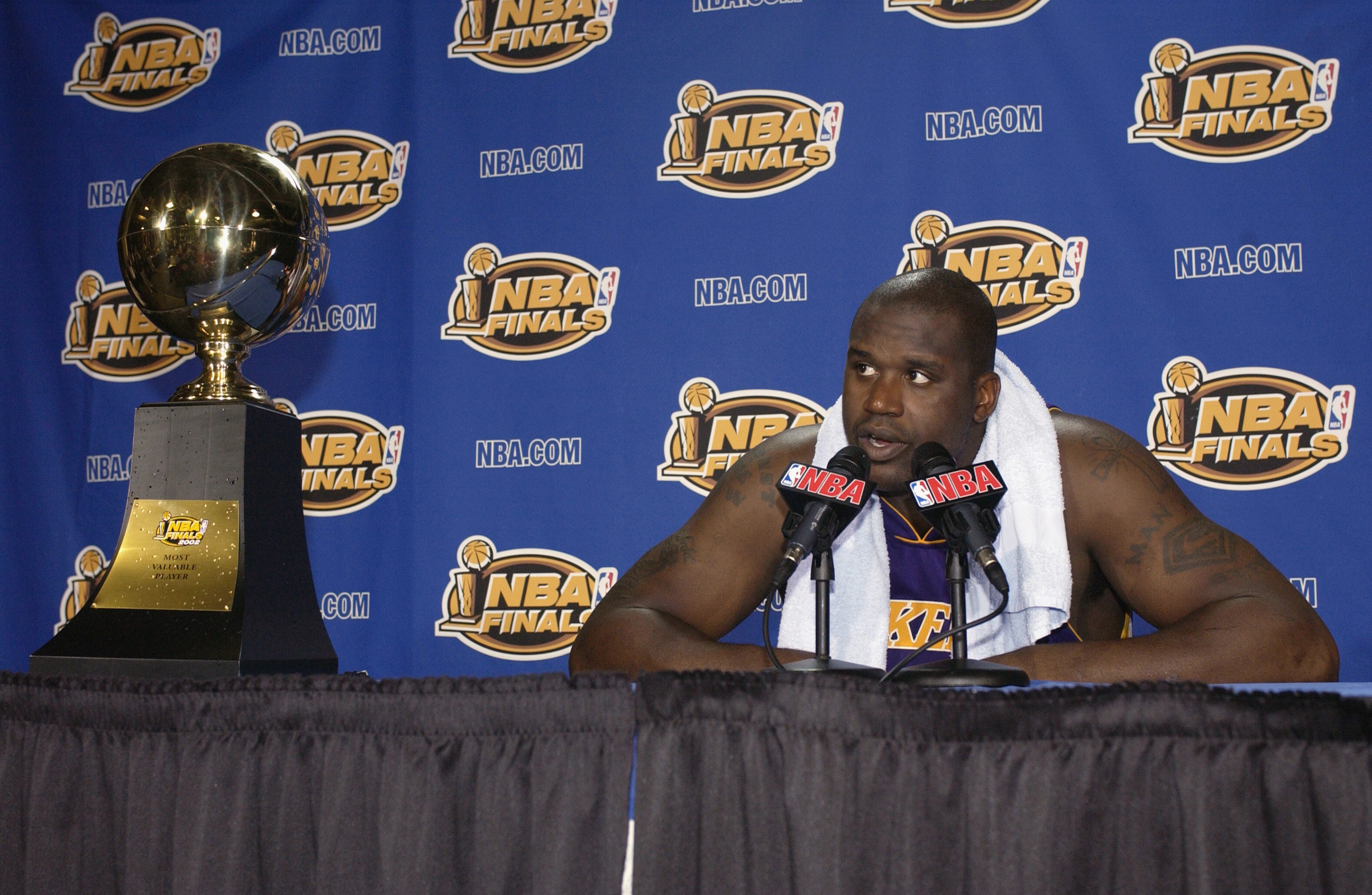 EAST RUTHERFORD, NJ - JUNE 12:  Shaquille O'Neal #34 of the Los Angeles Lakers speaks to the media after Game four of the 2002 NBA Finals against the New Jersey Nets on June 12, 2002 at Continental Airlines Arena in East Rutherford, New Jersey.  The Lakers won 113-107.  NOTE TO USER: User expressly acknowledges and agrees that, by downloading and/or using this Photograph, User is consenting to the terms and conditions of the Getty Images License Agreement.  Mandatory copyright notice: Copyright 2002 NBAE  (Photo by: M David Leeds/NBAE via Getty Images)