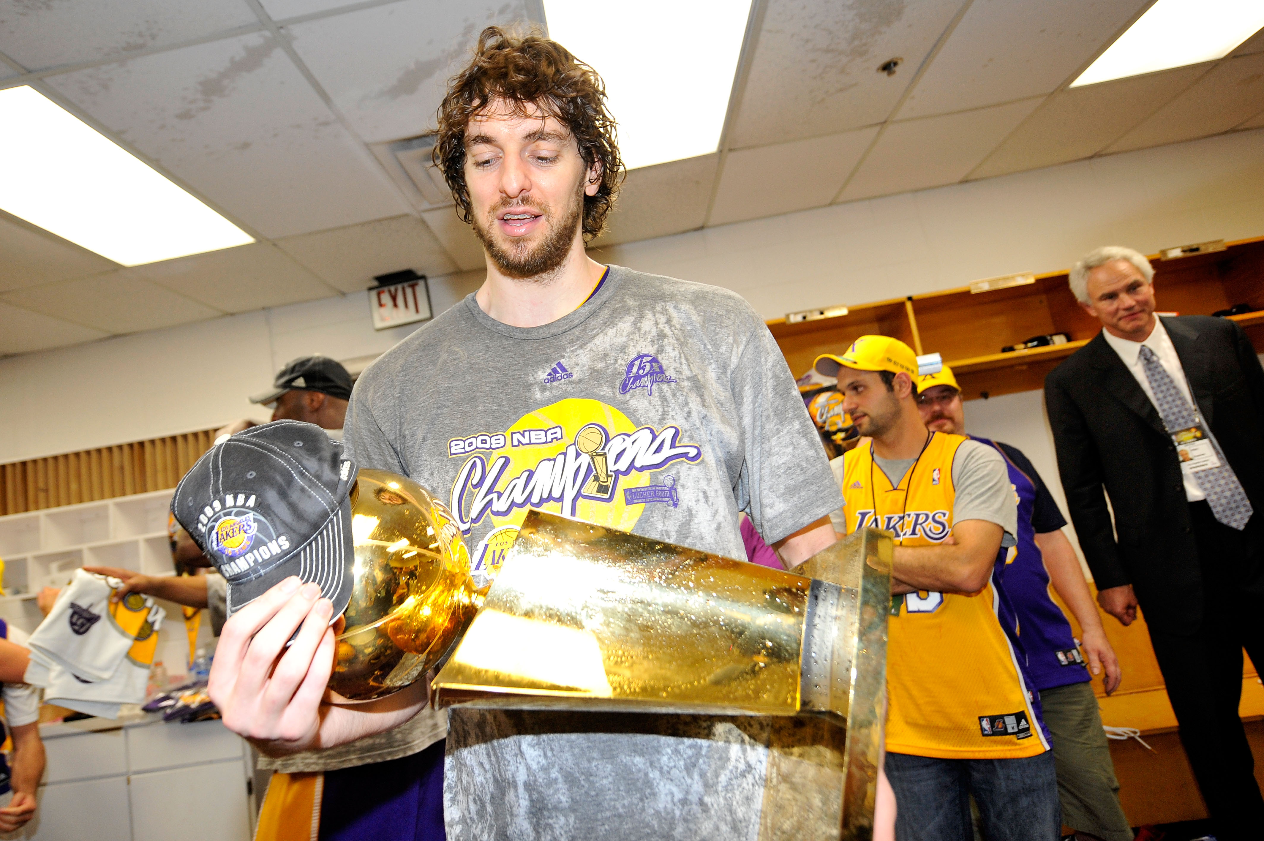 ORLANDO, FL - JUNE 14:  Pau Gasol #16 of the Los Angeles Lakers celebrates with the Larry O'Brien Championship trophy in the locker room after the Lakers won 99-86 to win the NBA Championship against the Orlando Magic in Game Five of the 2009 NBA Finals at Amway Arena on June 14, 2009 in Orlando, Florida. NOTE TO USER: User expressly acknowledges and agrees that, by downloading and or using this photograph, User is consenting to the terms and conditions of the Getty Images License Agreement. Mandatory Credit: 2009 NBAE  (Photo by Jesse D. Garrabrant/NBAE via Getty Images)