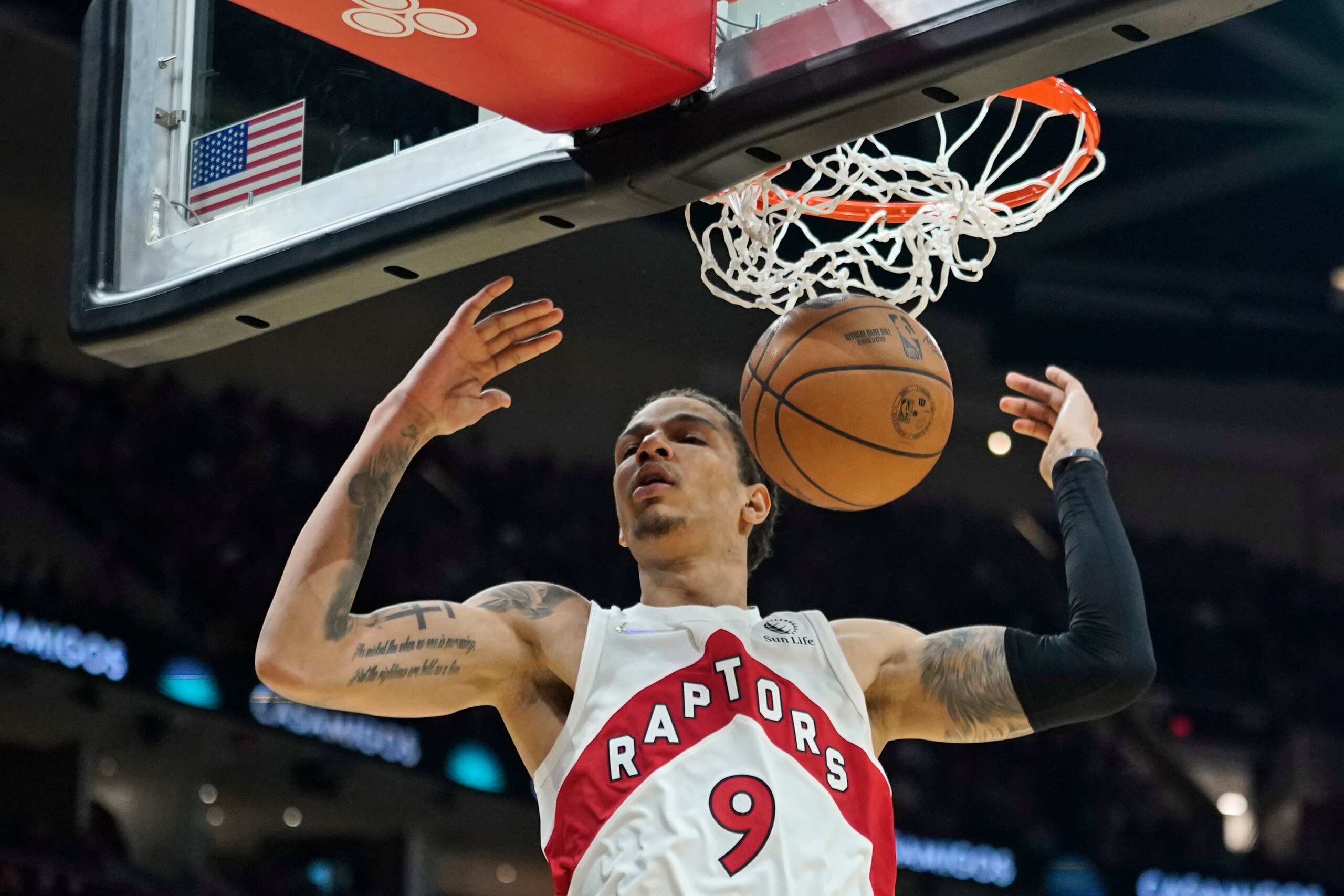Toronto Raptors' D.J. Wilson dunks against the Cleveland Cavaliers in the second half of an NBA basketball game, Sunday, Dec. 26, 2021, in Cleveland. (AP Photo/Tony Dejak)