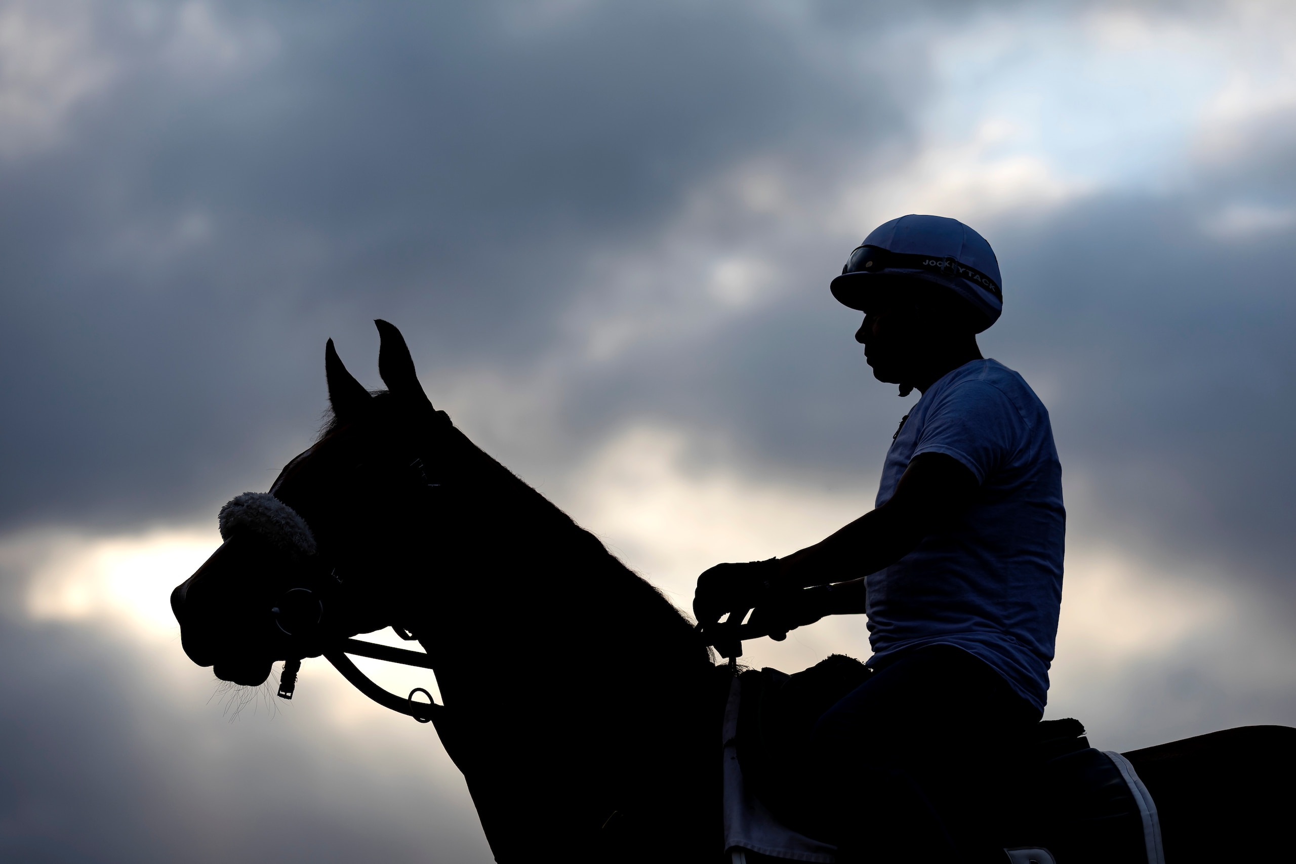 ELMONT, NEW YORK - JUNE 08:  An Exercise rider and horse look on during a morning workout prior to the 154th running of the Belmont Stakes at Belmont Park on June 08, 2022 in Elmont, New York. (Photo by Al Bello/Getty Images)