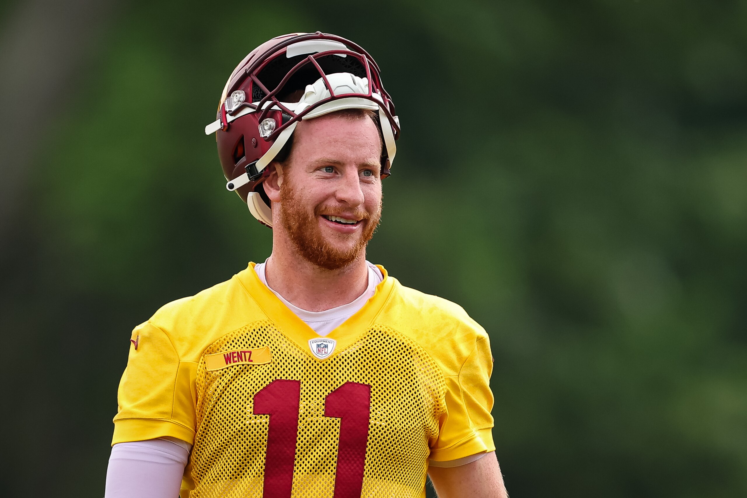 ASHBURN, VA - JUNE 08: Carson Wentz #11 of the Washington Commanders reacts during the organized team activity at INOVA Sports Performance Center on June 8, 2022 in Ashburn, Virginia. (Photo by Scott Taetsch/Getty Images)