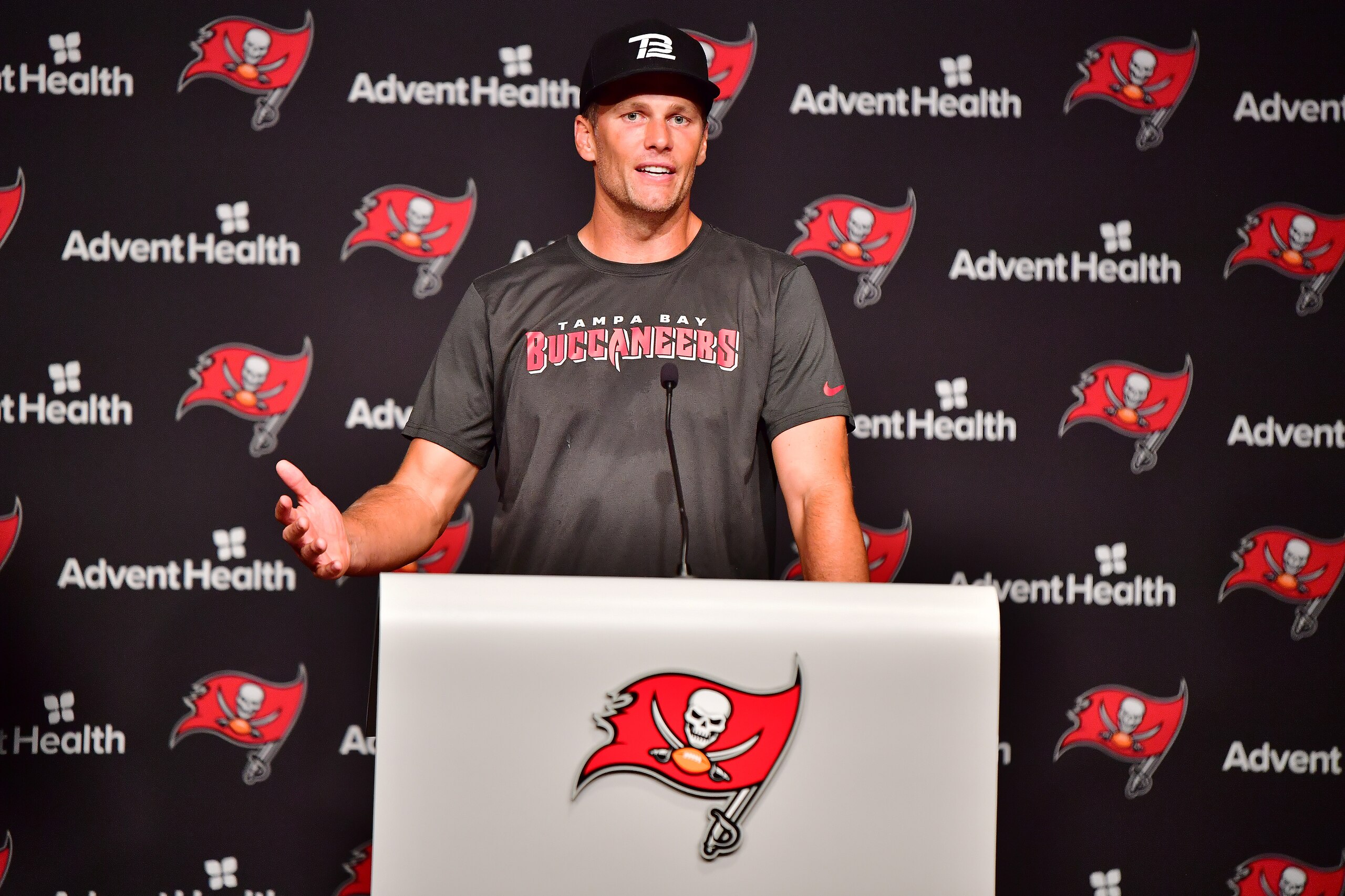 TAMPA, FLORIDA - JUNE 09: Tom Brady #12 of Tampa Bay Buccaneers answers questions at a press conference following the 2022 Buccaneers minicamp at AdventHealth Training Center on June 09, 2022 in Tampa, Florida. (Photo by Julio Aguilar/Getty Images)