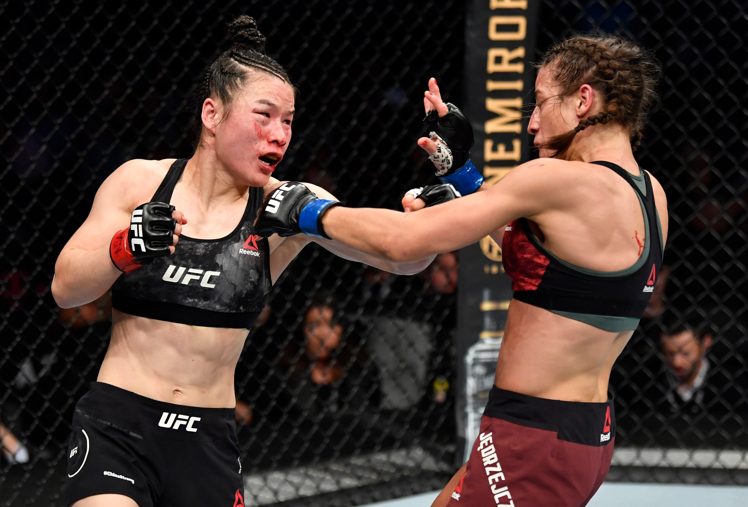 LAS VEGAS, NEVADA - MARCH 07: (L-R) Zhang Weili of China punches Joanna Jedrzejczyk of Poland in their UFC strawweight championship fight during the UFC 248 event at T-Mobile Arena on March 07, 2020 in Las Vegas, Nevada. (Photo by Jeff Bottari/Zuffa LLC)
