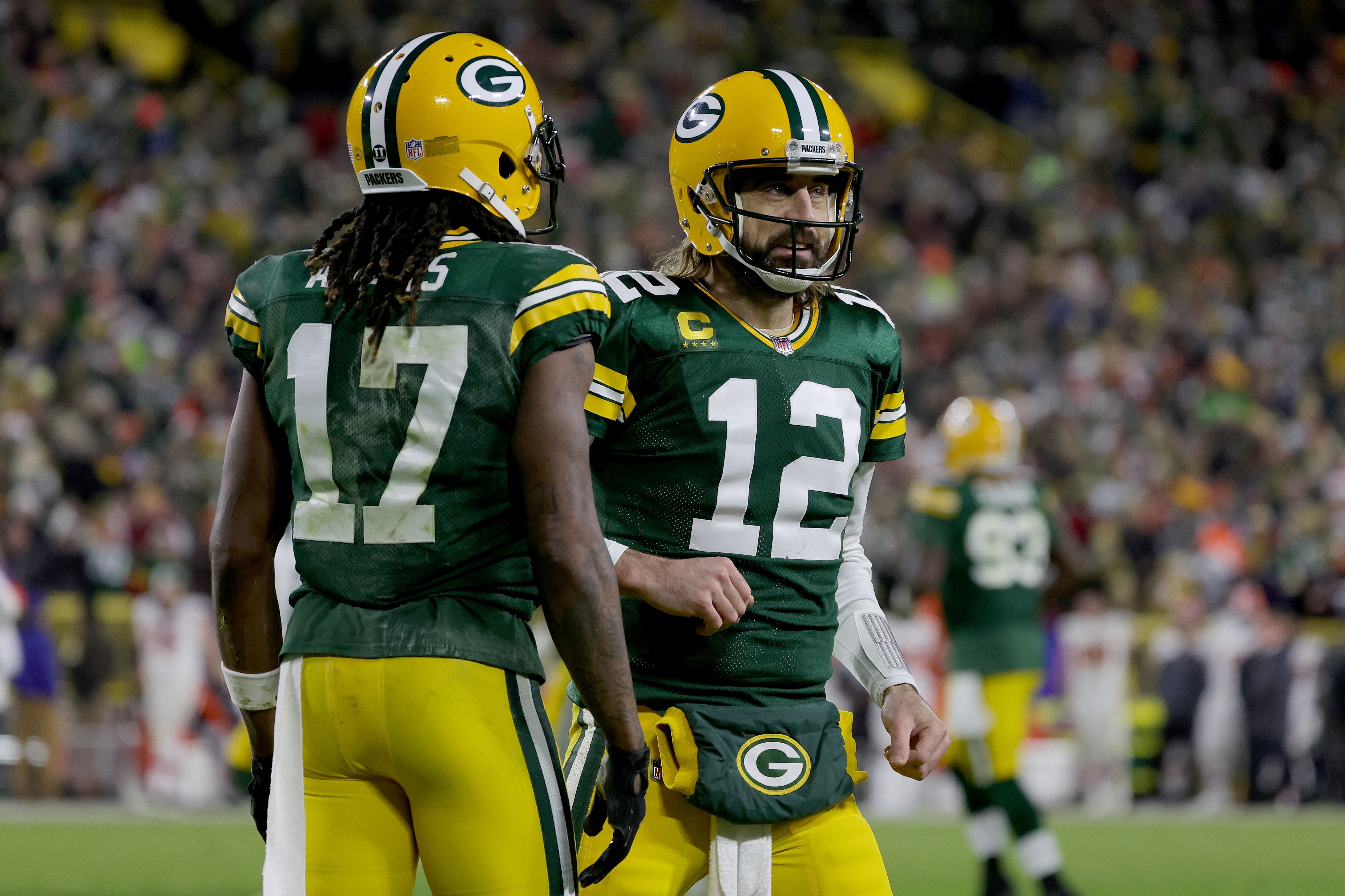 GREEN BAY, WISCONSIN - DECEMBER 25: Davante Adams #17 and Aaron Rodgers #12 of the Green Bay Packers celebrate after scoring a touchdown in the second quarter against the Cleveland Browns at Lambeau Field on December 25, 2021 in Green Bay, Wisconsin. (Photo by Stacy Revere/Getty Images)