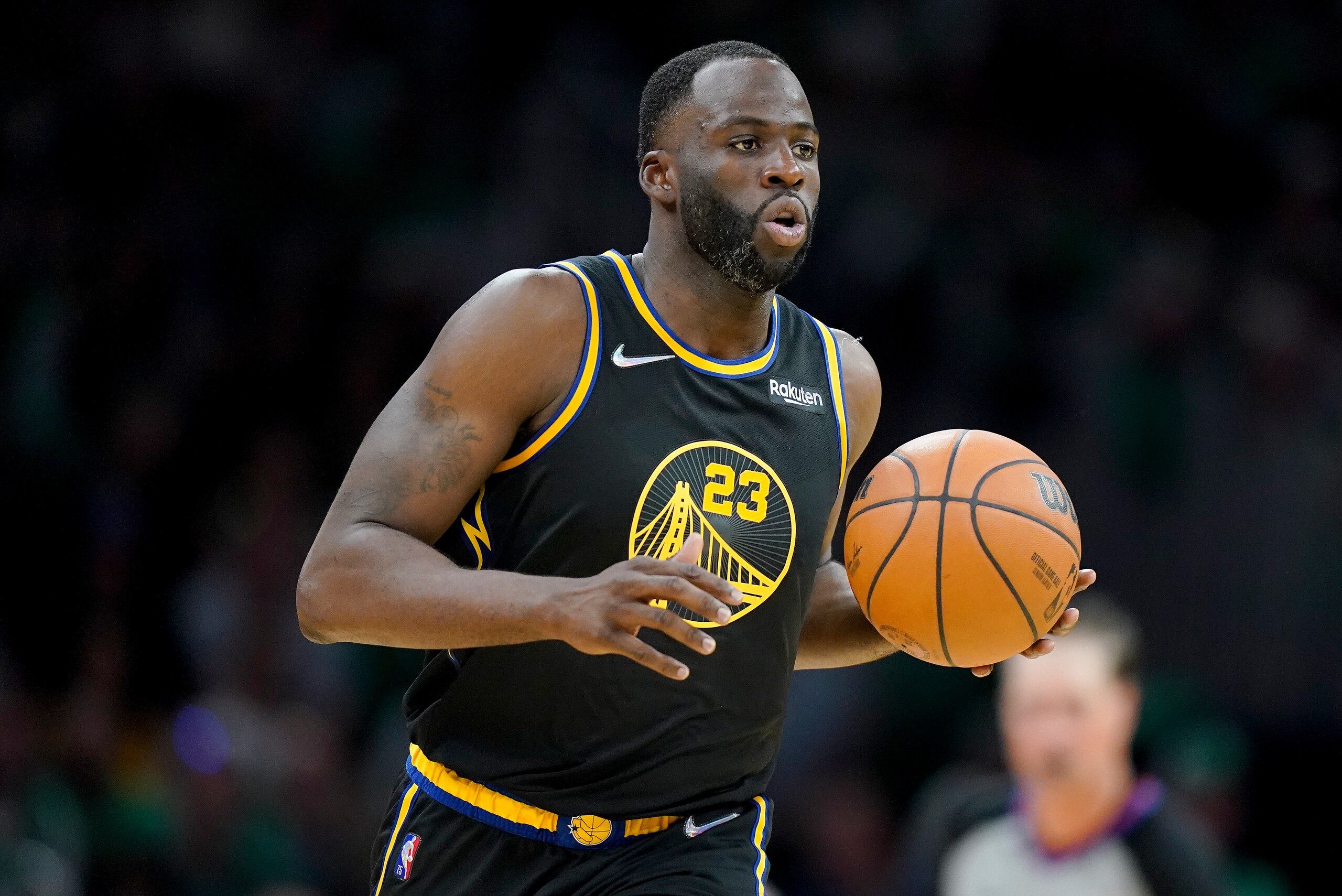 Golden State Warriors forward Draymond Green (23) brings the ball up court during the fourth quarter of Game 3 of basketball's NBA Finals against the Boston Celtics, Wednesday, June 8, 2022, in Boston. (AP Photo/Steven Senne)