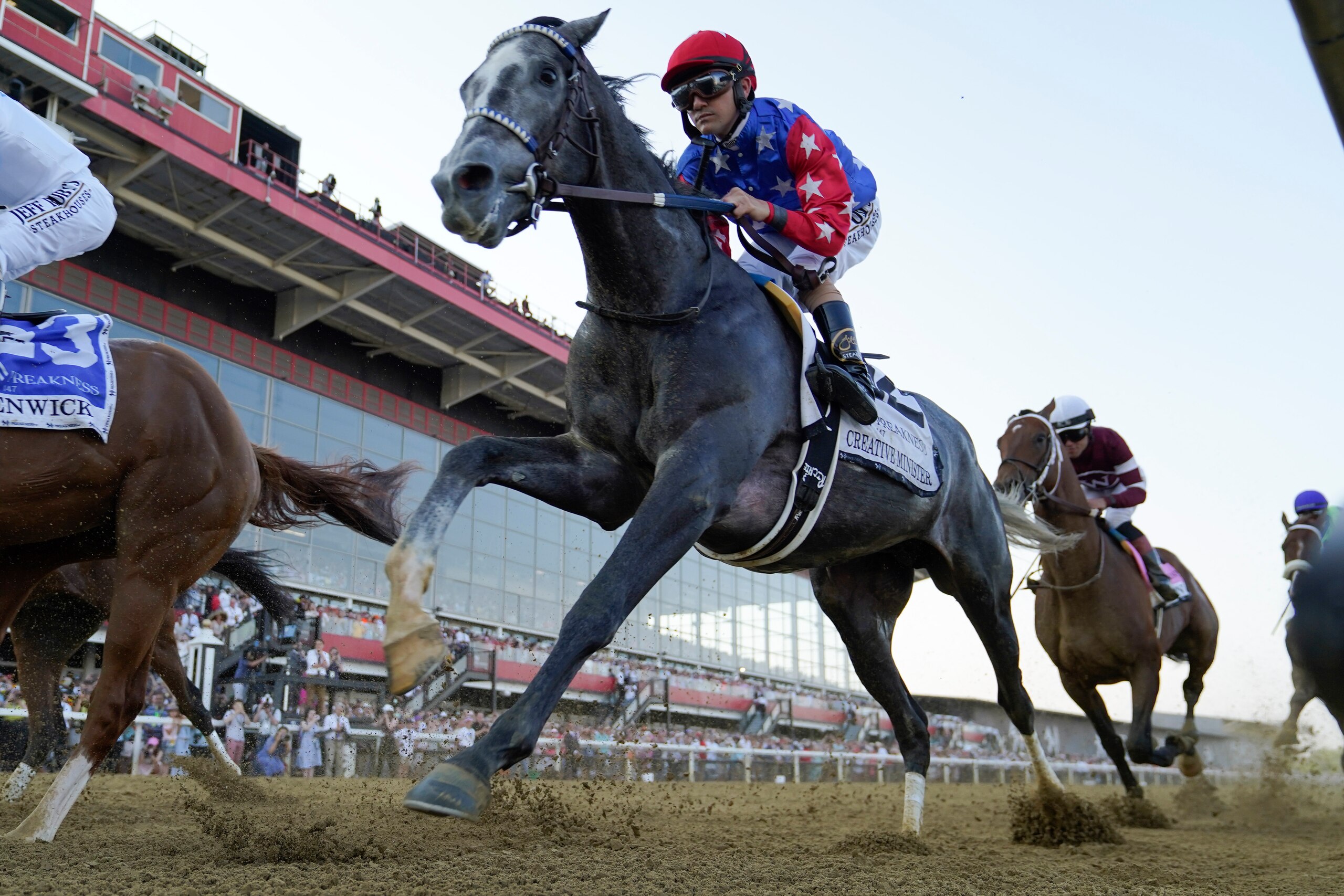 Brian Hernandez Jr. atop Creative Minister participates in the 147th running of the Preakness Stakes horse race at Pimlico Race Course, Saturday, May 21, 2022, in Baltimore. (AP Photo/Julio Cortez)