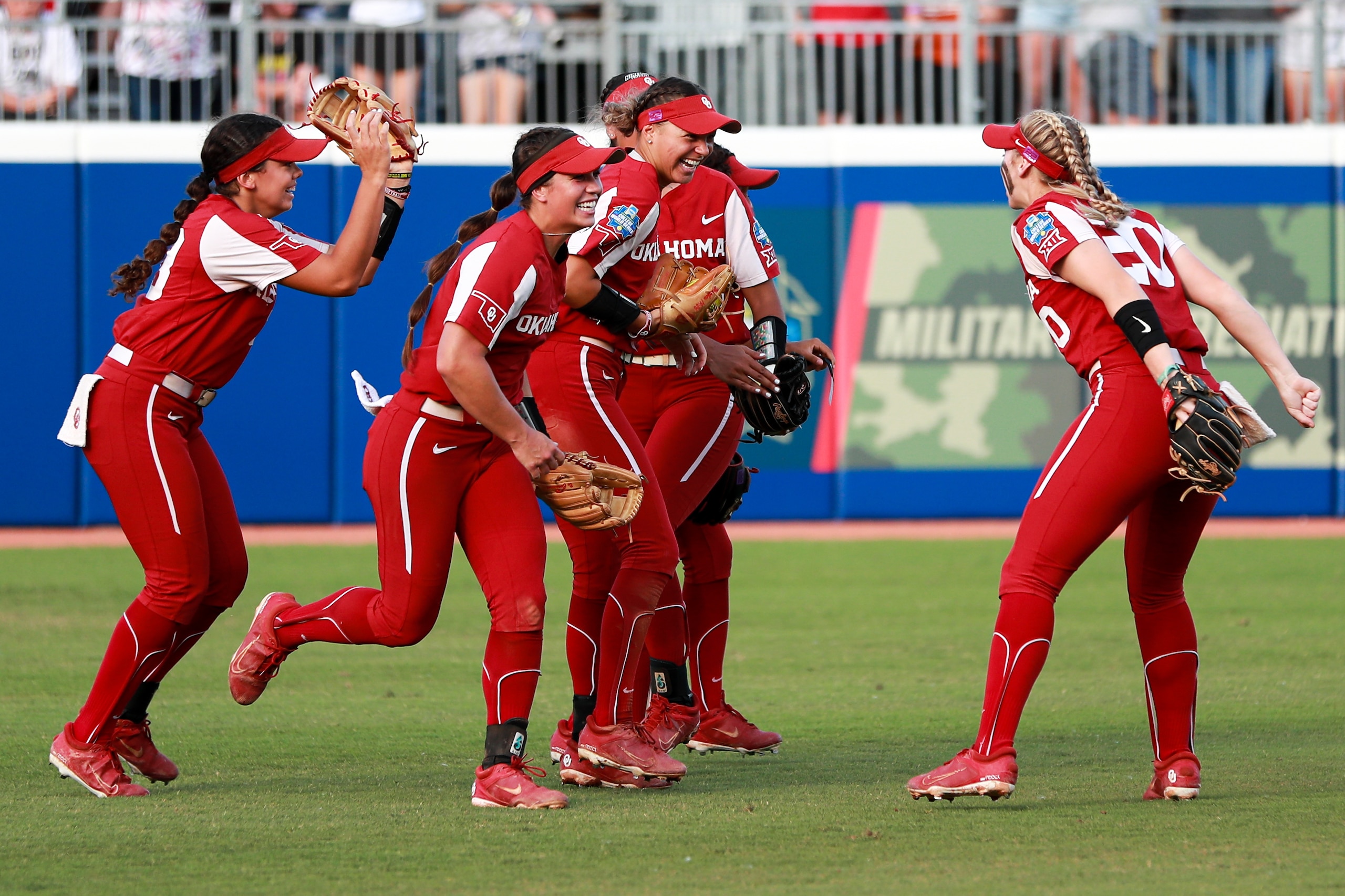 OKLAHOMA CITY, OK - JUNE 09: The Oklahoma Sooners celebrate after Jayda Coleman #24 saved a home run during the first inning against the Texas Longhorns during the Division I Womens Softball Championship held at ASA Hall of Fame Stadium on June 9, 2022 in Oklahoma City, Oklahoma. (Photo by Isaiah Vazquez/NCAA Photos via Getty Images)