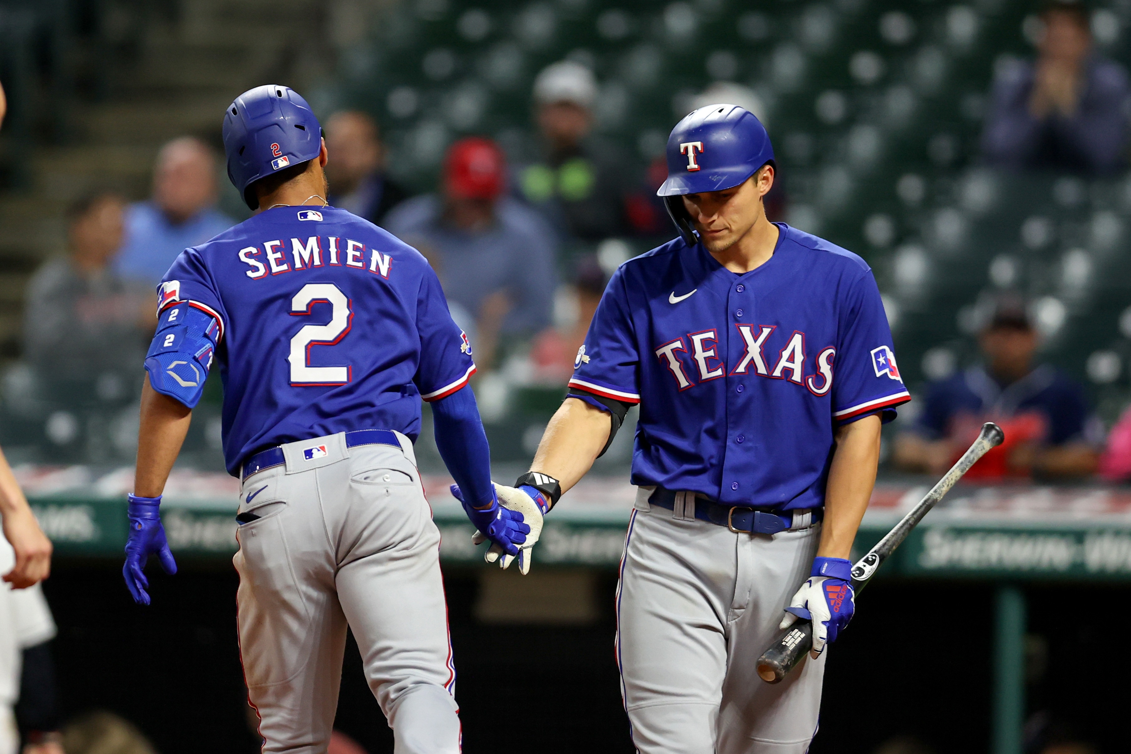 CLEVELAND, OH - JUNE 07: Texas Rangers second baseman Marcus Semien (2) is congratulated by Texas Rangers shortstop Corey Seager (5) after hitting his second home run of the game during the eighth inning of game 2 of the the Major League Baseball doubleheader between the Texas Rangers and Cleveland Guardinas on June 7, 2022, at Progressive Field in Cleveland, OH. (Photo by Frank Jansky/Icon Sportswire via Getty Images)