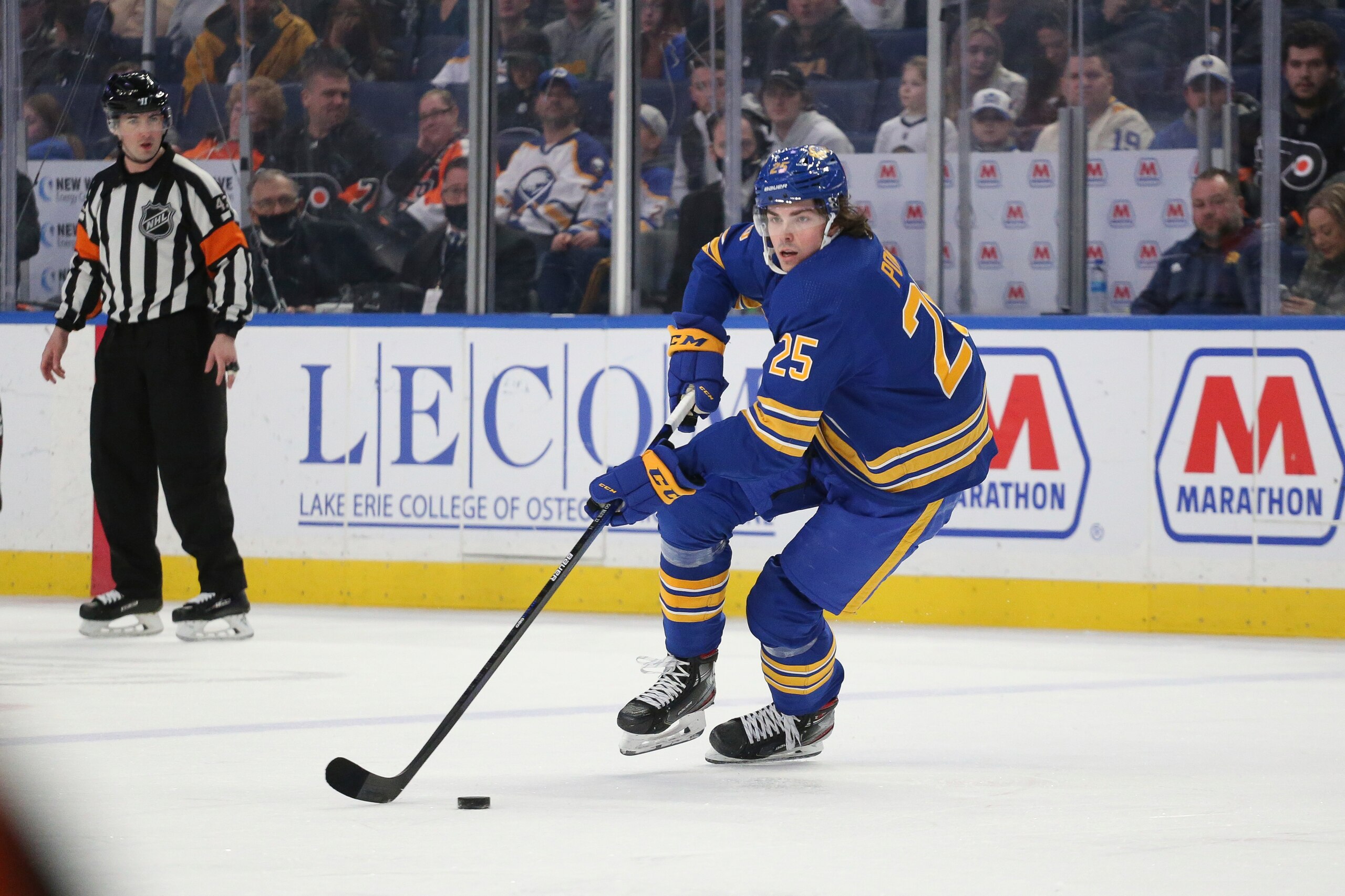 Buffalo Sabres defenseman Owen Power (25) skates with the puck during the second period of an NHL hockey game against the Philadelphia Flyers on Saturday, April. 16, 2022, in Buffalo, N.Y. (AP Photo/Joshua Bessex)