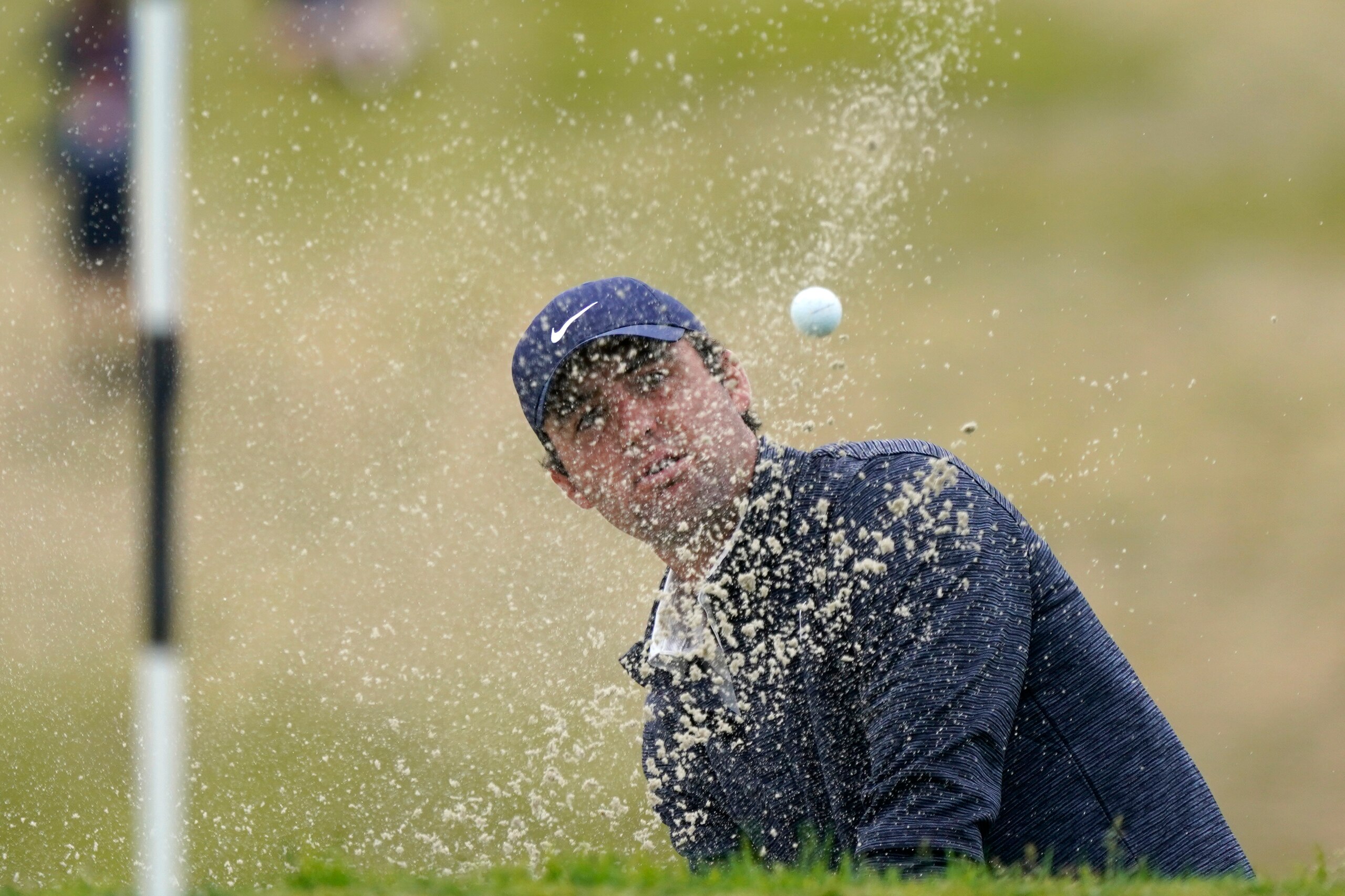 Scottie Scheffler plays a shot from a bunker on the 13th hole during the final round of the U.S. Open Golf Championship, Sunday, June 20, 2021, at Torrey Pines Golf Course in San Diego. (AP Photo/Marcio Jose Sanchez)