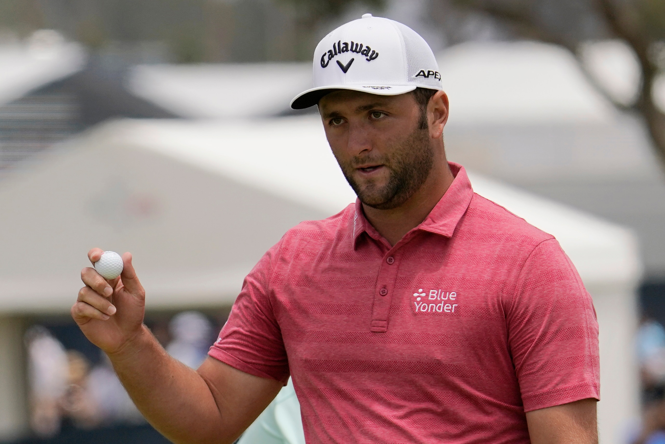 FILE - Jon Rahm, of Spain, holds the ball after his putt on the first green during the final round of the U.S. Open Golf Championship, June 20, 2021, at Torrey Pines Golf Course in San Diego. The Masters is scheduled for April 7-10, 2022 at Augusta National in Augusta, Ga. (AP Photo/Gregory Bull)