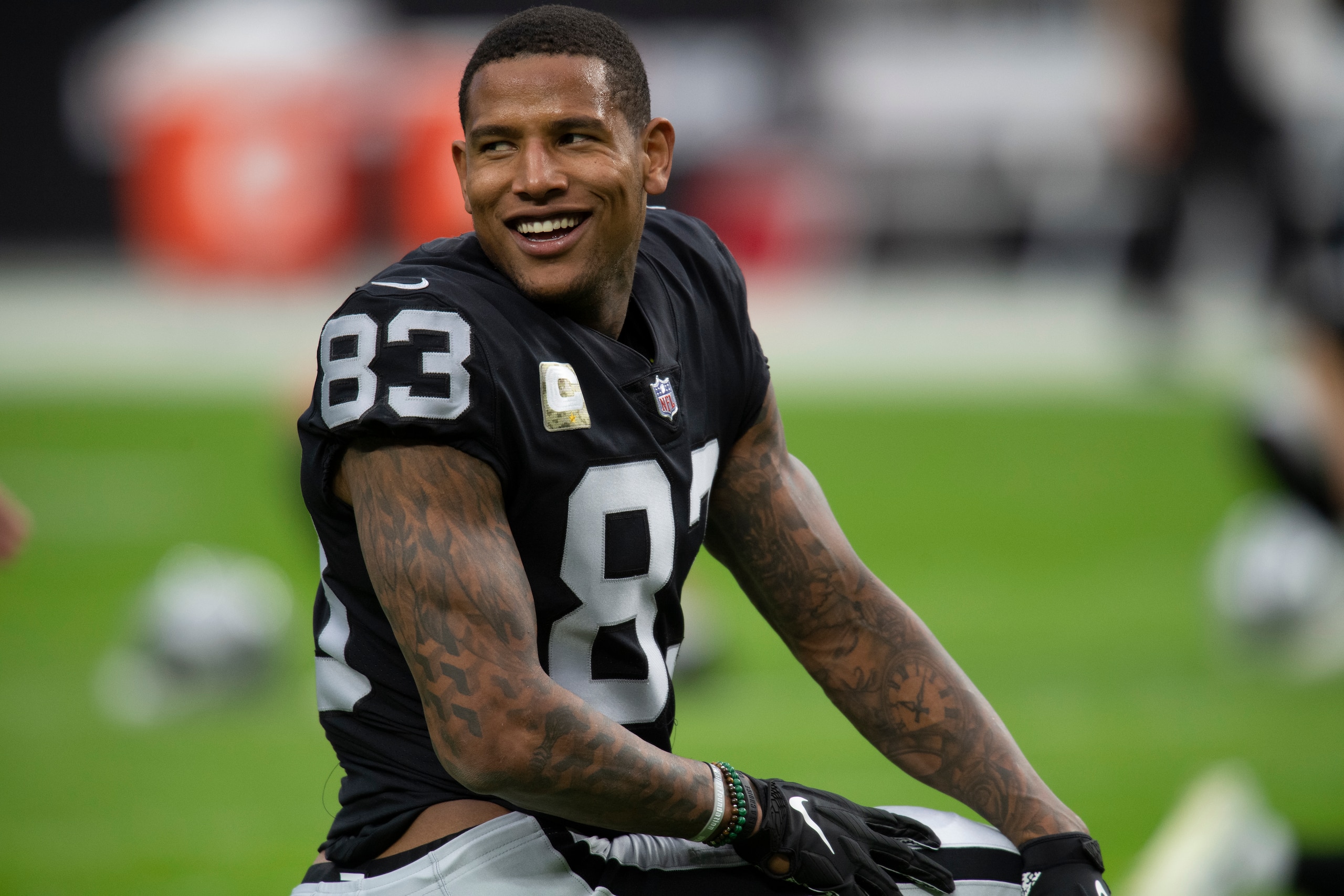 FILE - Las Vegas Raiders tight end Darren Waller (83) with his helmet off before a game against the Cincinnati Bengals during an NFL football game on Nov. 21, 2021, in Las Vegas, Nev. Waller and many of the NFL’s tight ends will gather in June, 2022, for the second Tight End University camp. (AP Photo/John McCoy, File)