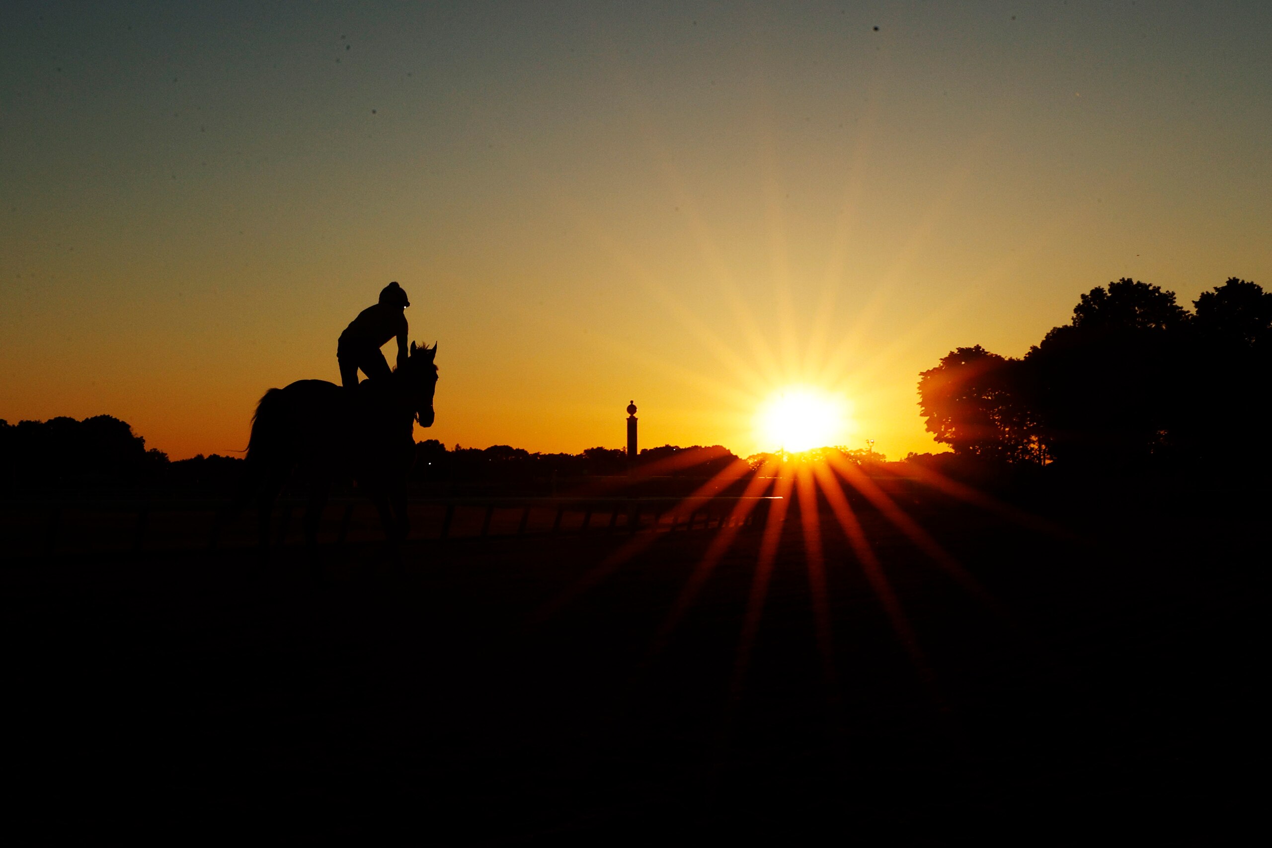 ELMONT, NEW YORK - JUNE 10: Exercise riders and horses train during a morning workout prior to the 154th running of the Belmont Stakes at Belmont Park on June 10, 2022 in Elmont, New York. (Photo by Sarah Stier/Getty Images)