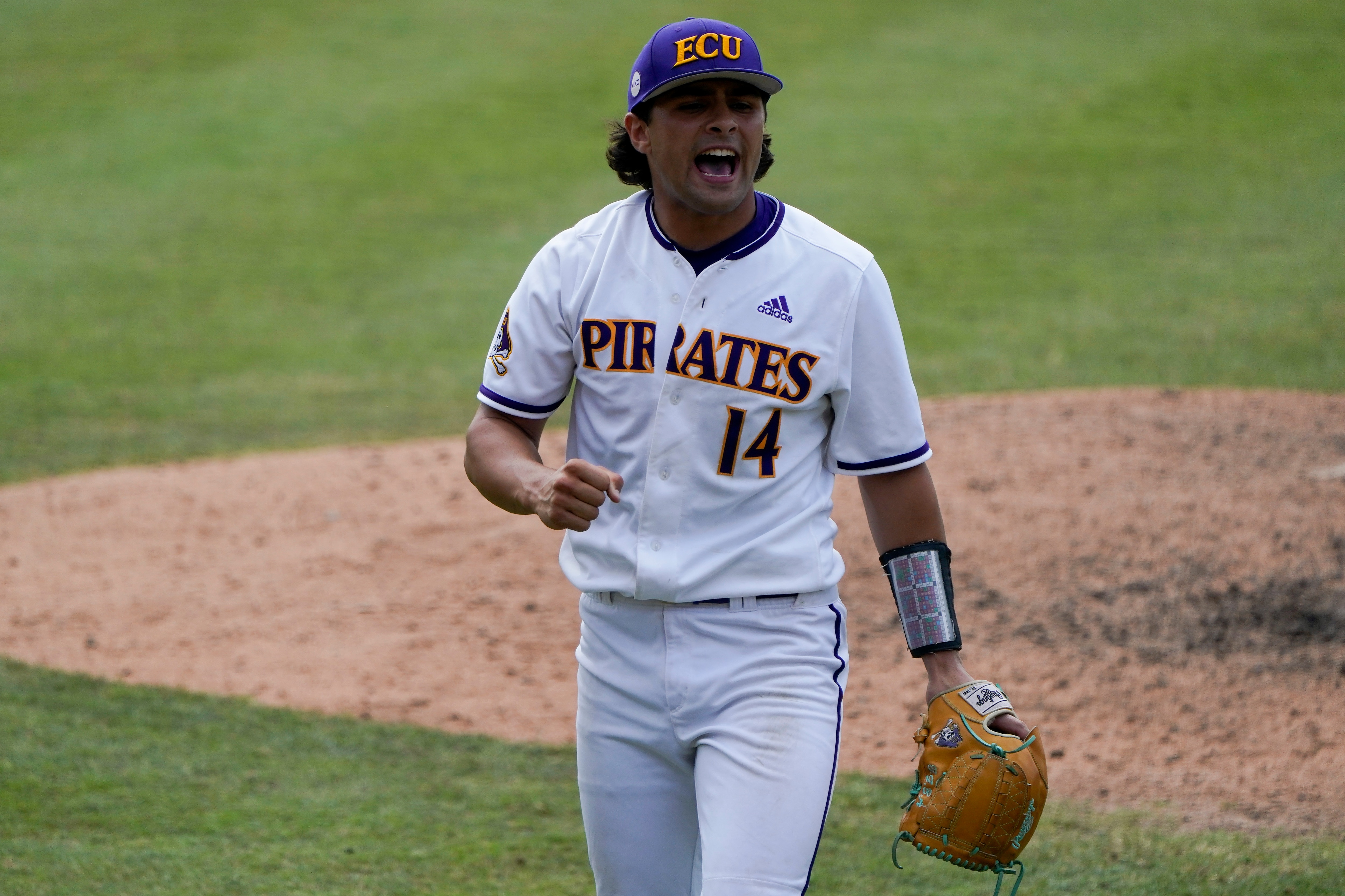 East Carolina pitcher Zach Agnos celebrates their win against Texas during an NCAA college super regional baseball game Friday, June 10, 2022, in Greenville, N.C. (AP Photo/Chris Carlson)