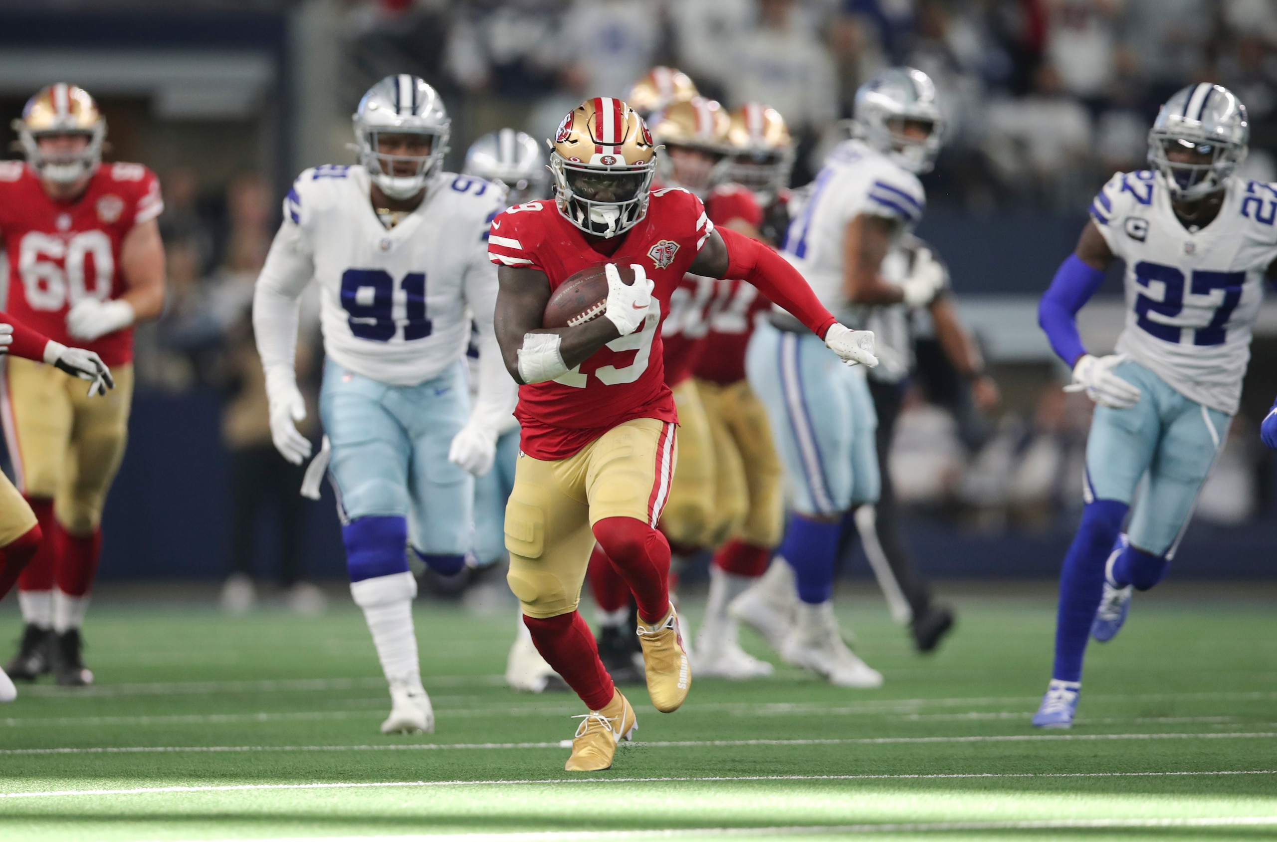 ARLINGTON, TX - JANUARY 16: Deebo Samuel #19 of the San Francisco 49ers runs after making a catch during the NFC Wild Card Playoff game against the Dallas Cowboys at AT&T Stadium on January 16, 2022 in Arlington, Texas. The 49ers defeated the Cowboys 23-17. (Photo by Michael Zagaris/San Francisco 49ers/Getty Images) ARLINGTON, TX - JANUARY 16: Deebo Samuel #19 of the San Francisco 49ers runs after making a catch during the NFC Wild Card Playoff game against the Dallas Cowboys at AT&T Stadium on January 16, 2022 in Arlington, Texas. The 49ers defeated the Cowboys 23-17. (Photo by Michael Zagaris/San Francisco 49ers/Getty Images)