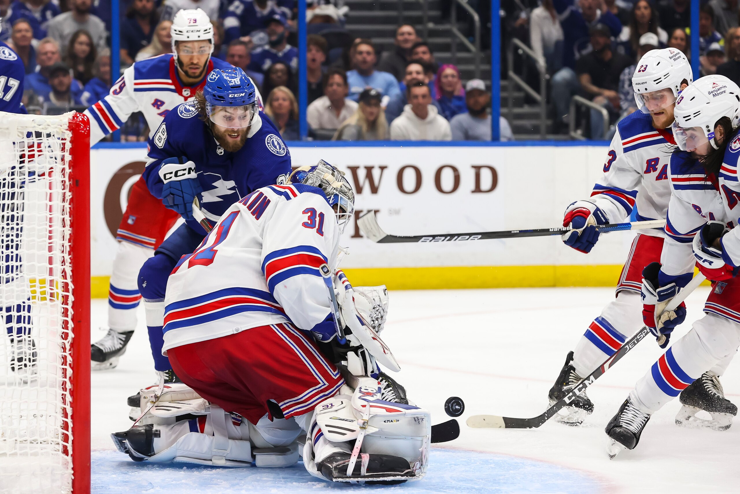 TAMPA, FL - JUNE 11: Brandon Hagel #38 of the Tampa Bay Lightning looks for the rebound against goalie Igor Shesterkin #31, Adam Fox #23, and Mika Zibanejad #93 of the New York Rangers during the third period in Game Six of the Eastern Conference Final of the 2022 Stanley Cup Playoffs at Amalie Arena on June 11, 2022 in Tampa, Florida. (Photo by Mark LoMoglio/NHLI via Getty Images) TAMPA, FL - JUNE 11: Brandon Hagel #38 of the Tampa Bay Lightning looks for the rebound against goalie Igor Shesterkin #31, Adam Fox #23, and Mika Zibanejad #93 of the New York Rangers during the third period in Game Six of the Eastern Conference Final of the 2022 Stanley Cup Playoffs at Amalie Arena on June 11, 2022 in Tampa, Florida. (Photo by Mark LoMoglio/NHLI via Getty Images)