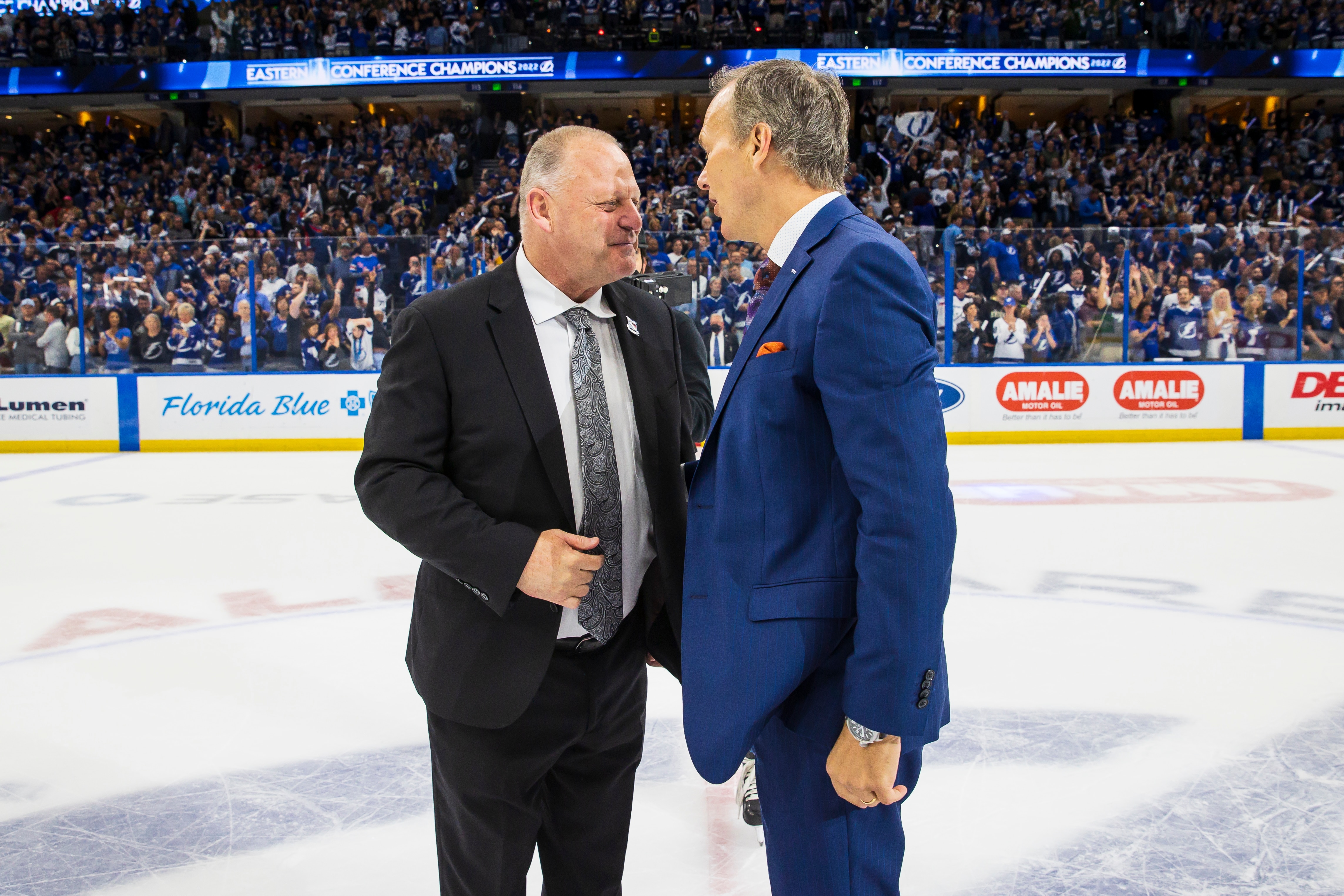 TAMPA, FL - JUNE 11: Head coach Jon Cooper of the Tampa Bay Lightning celebrates the series win against Gerard Gallant of New York Rangers after Game Six of the Eastern Conference Final of the 2022 Stanley Cup Playoffs at Amalie Arena on June 11, 2022 in Tampa, Florida. (Photo by Mark LoMoglio/NHLI via Getty Images)