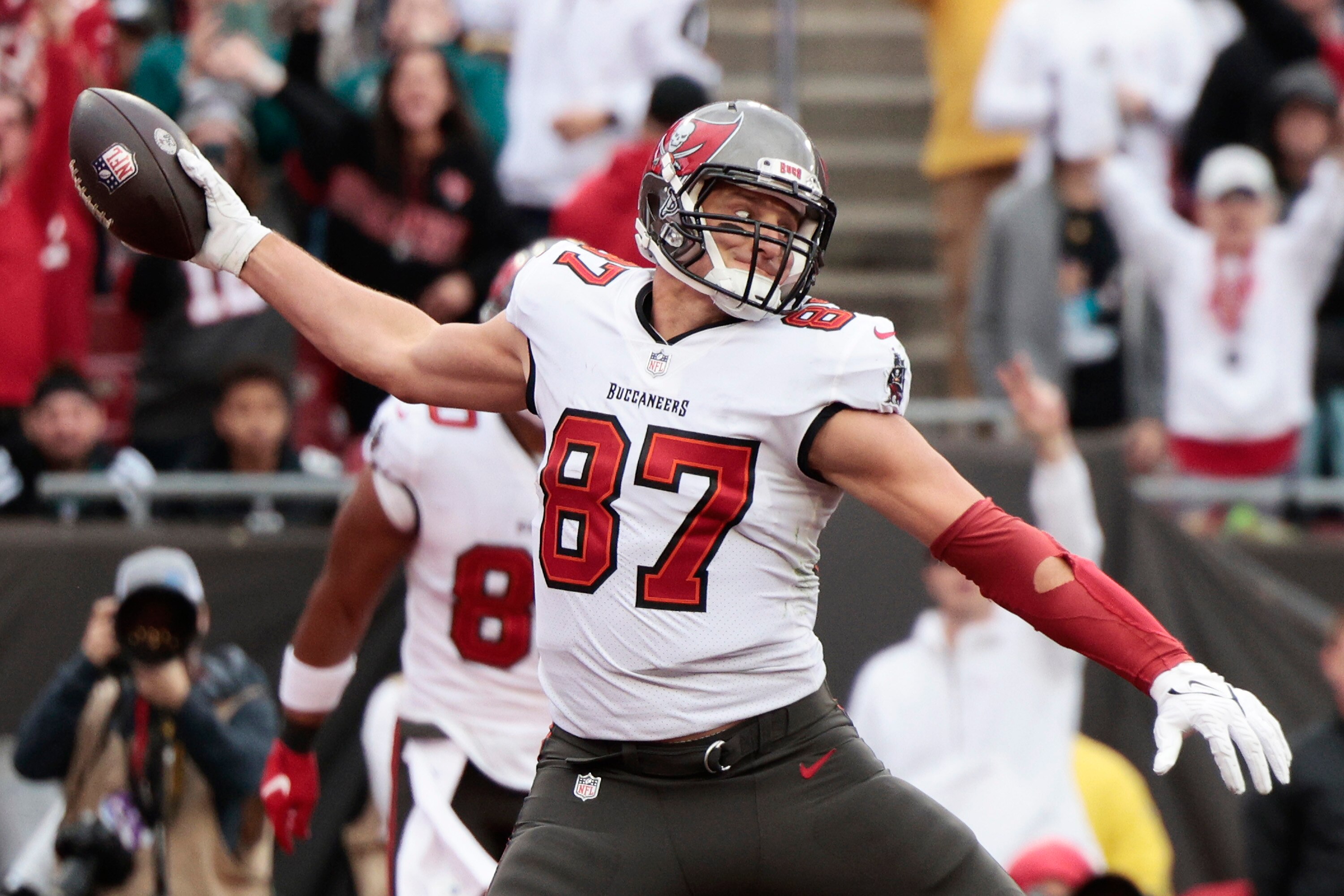 TAMPA, FLORIDA - JANUARY 16: Rob Gronkowski #87 of the Tampa Bay Buccaneers reacts after scoring a touchdown during the game against the Philadelphia Eagles in the NFC Wild Card Playoff game at Raymond James Stadium on January 16, 2022 in Tampa, Florida. (Photo by Douglas P. DeFelice/Getty Images)