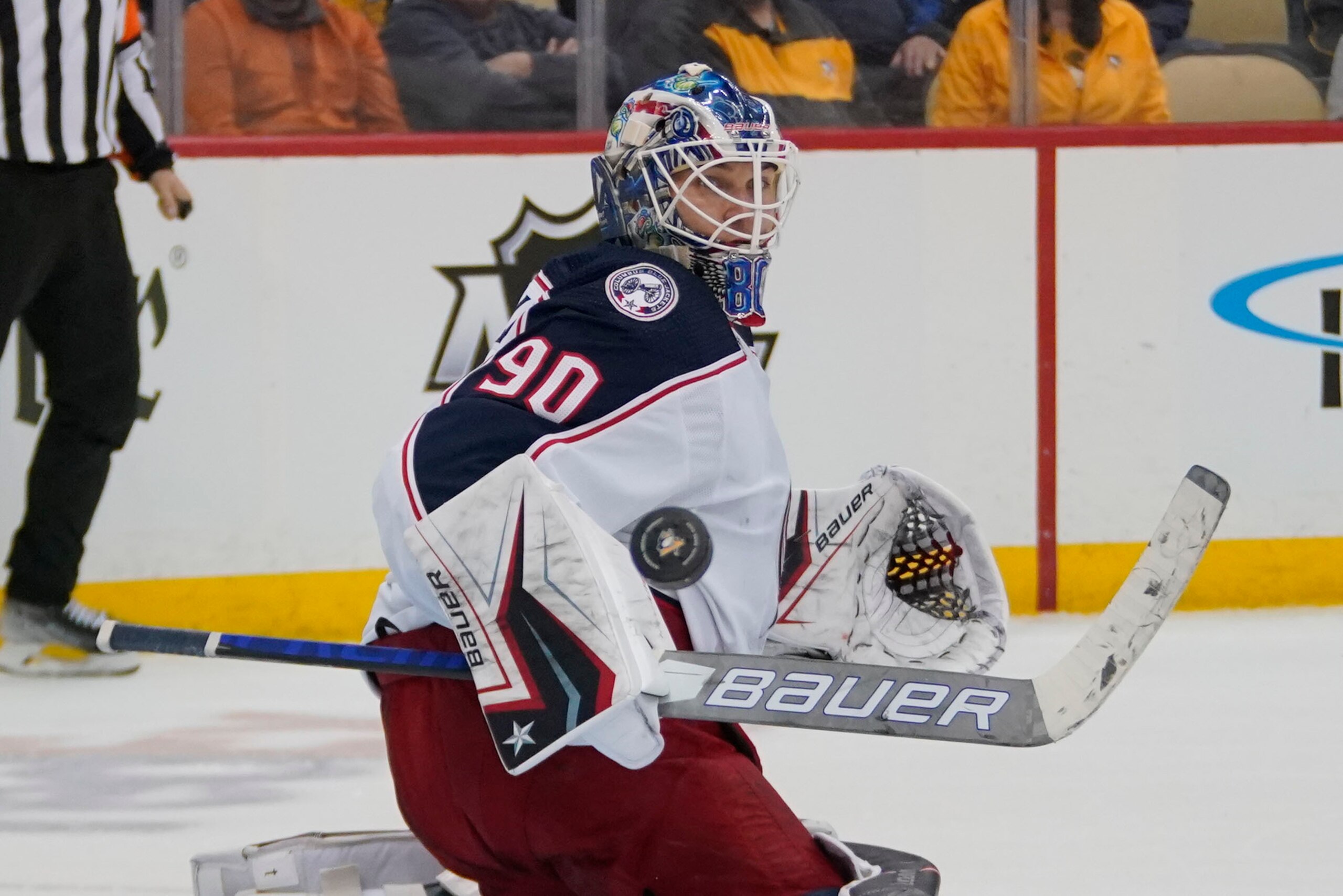 Columbus Blue Jackets goaltender Elvis Merzlikins blocks a shot during the second period of an NHL hockey game against the Pittsburgh Penguins in Pittsburgh, Friday, April 29, 2022. (AP Photo/Gene J. Puskar) Columbus Blue Jackets goaltender Elvis Merzlikins blocks a shot during the second period of an NHL hockey game against the Pittsburgh Penguins in Pittsburgh, Friday, April 29, 2022. (AP Photo/Gene J. Puskar)