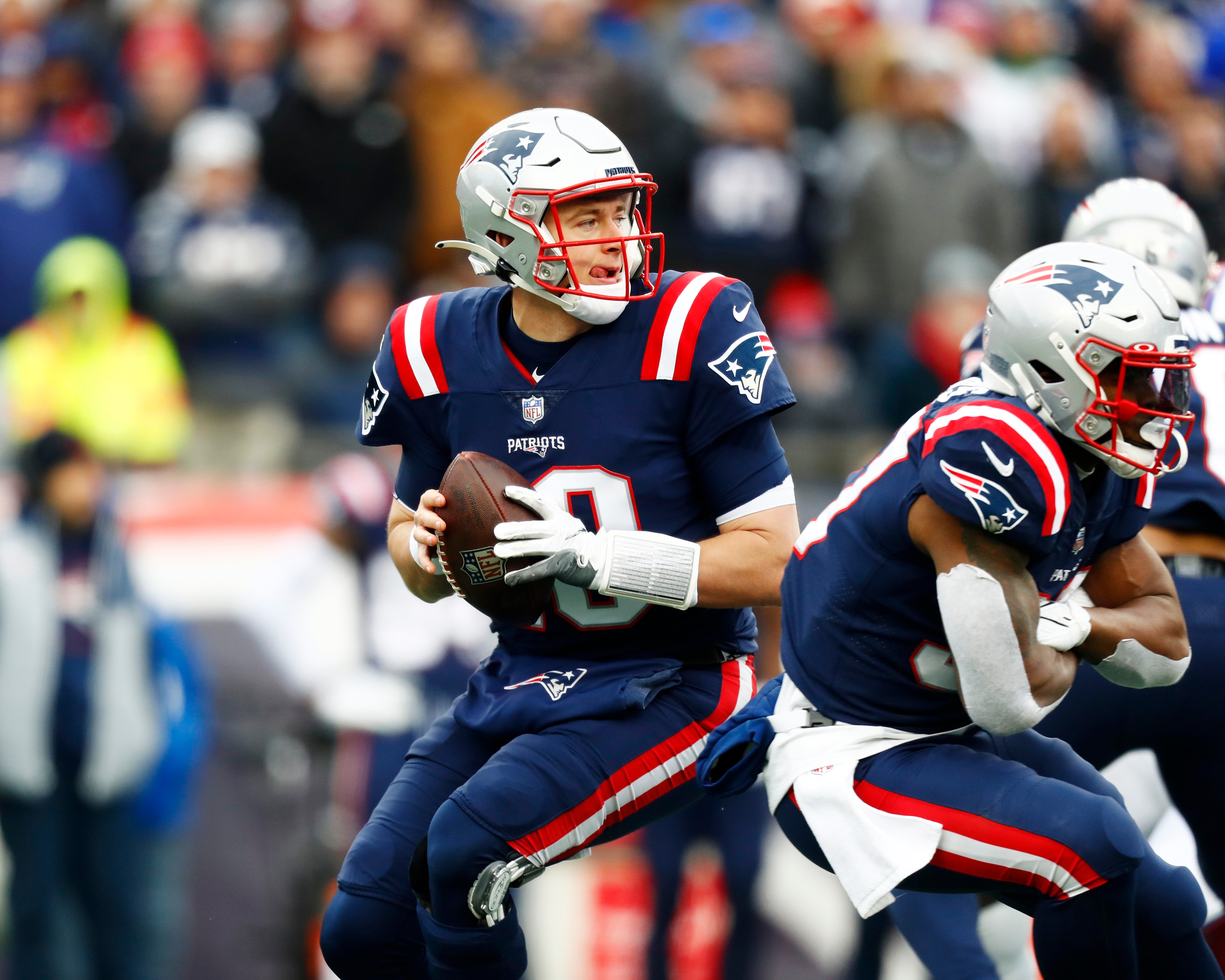 FOXBOROUGH, MASSACHUSETTS - DECEMBER 26: Quarterback  Mac Jones #10 of the New England Patriots looks to pass during the second quarter of the game against the Buffalo Bills at Gillette Stadium on December 26, 2021 in Foxborough, Massachusetts. (Photo by Omar Rawlings/Getty Images)