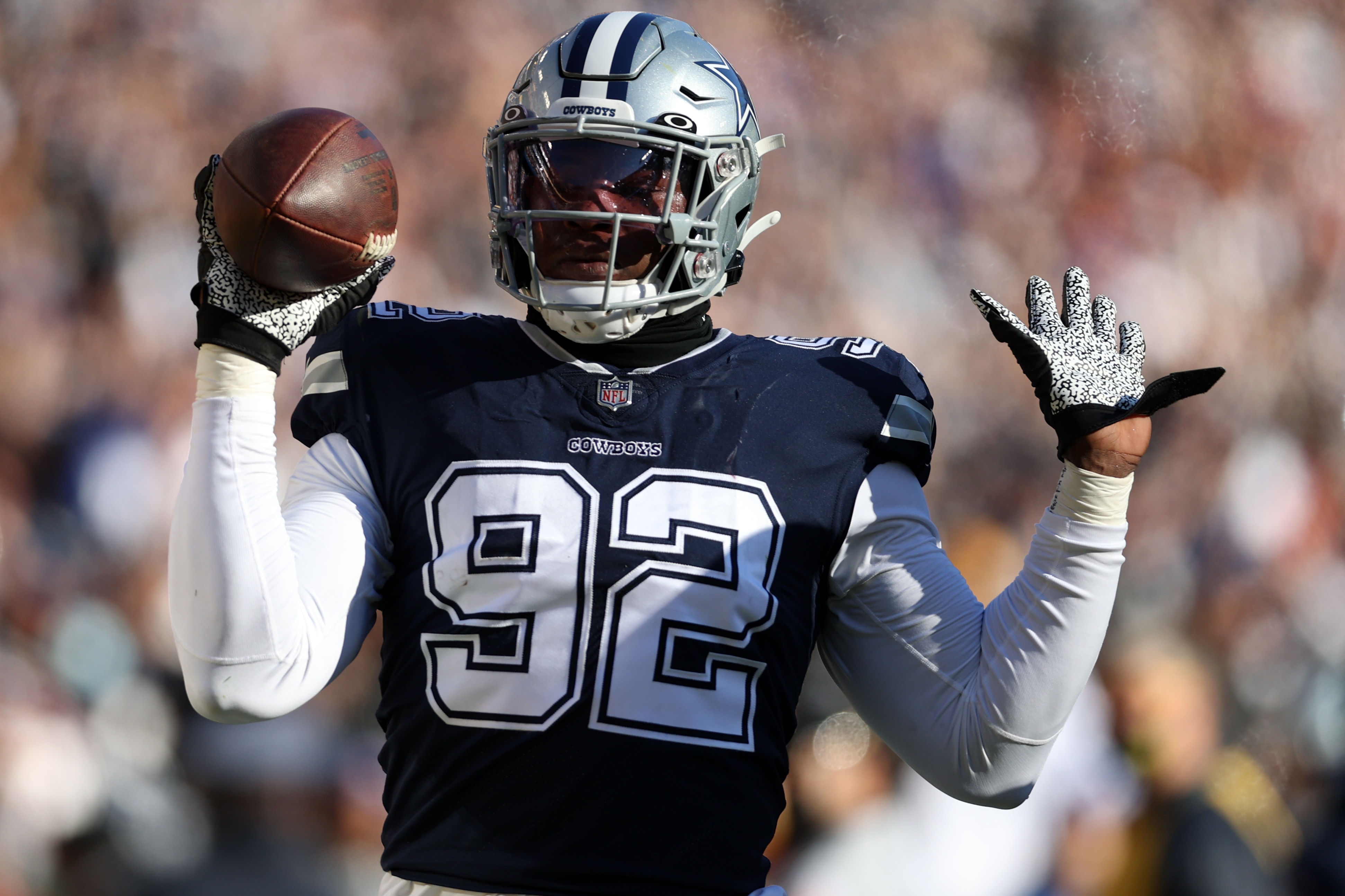 LANDOVER, MARYLAND - DECEMBER 12: Dorance Armstrong #92 of the Dallas Cowboys celebrates after returning a fumble for a touchdown during the first quarter against the Washington Football Team at FedExField on December 12, 2021 in Landover, Maryland. (Photo by Rob Carr/Getty Images)