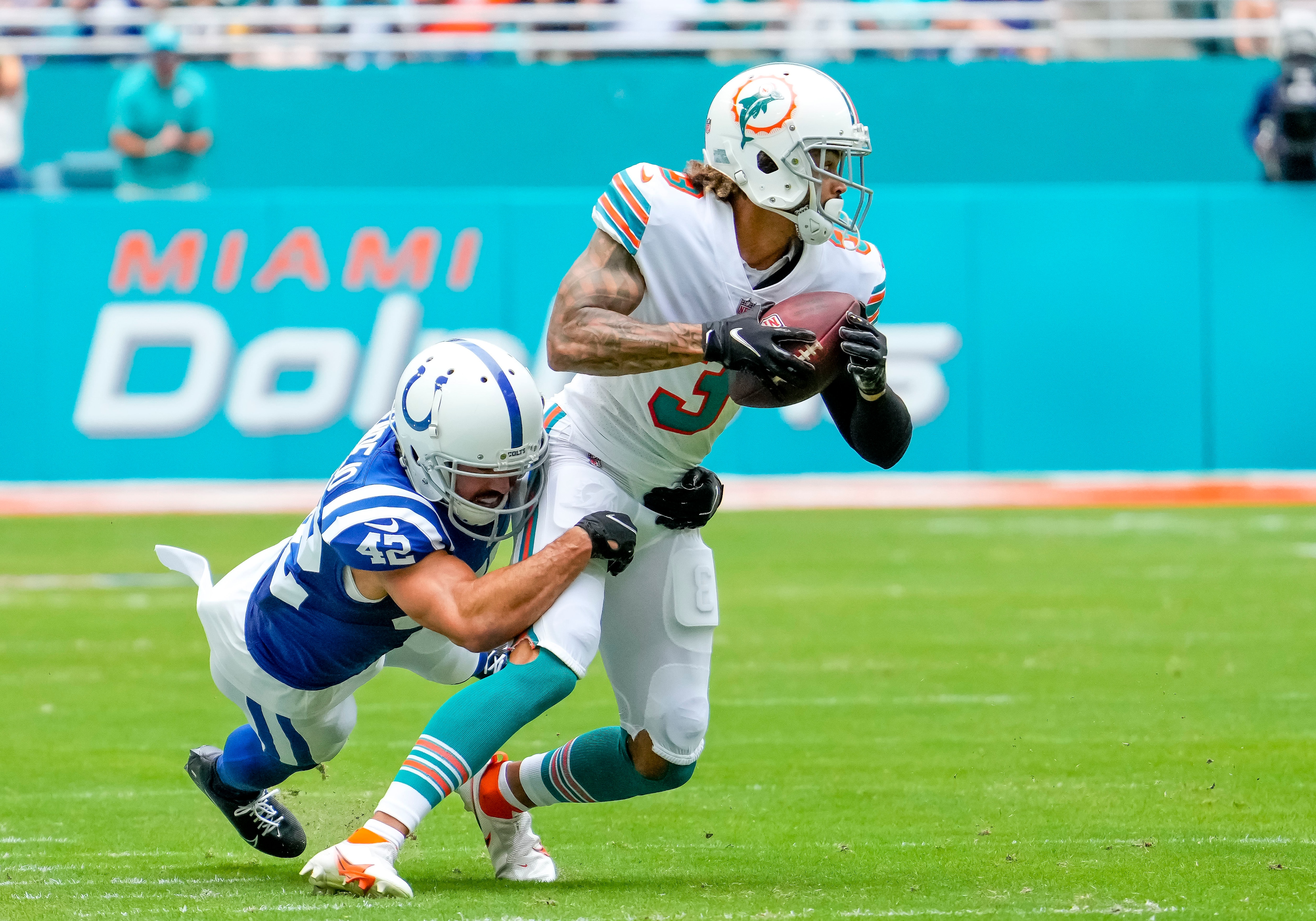 MIAMI GARDENS, FL - OCTOBER 03: Indianapolis Colts defensive back Rolan Milligan (42) tackles Miami Dolphins wide receiver Will Fuller (3) during the NFL Football match between the Miami Dolphins and Indianapolis  Colts on October 3rd, 2021 at Hard Rock Stadium in Miami, FL. (Photo by Andrew Bershaw/Icon Sportswire via Getty Images)
