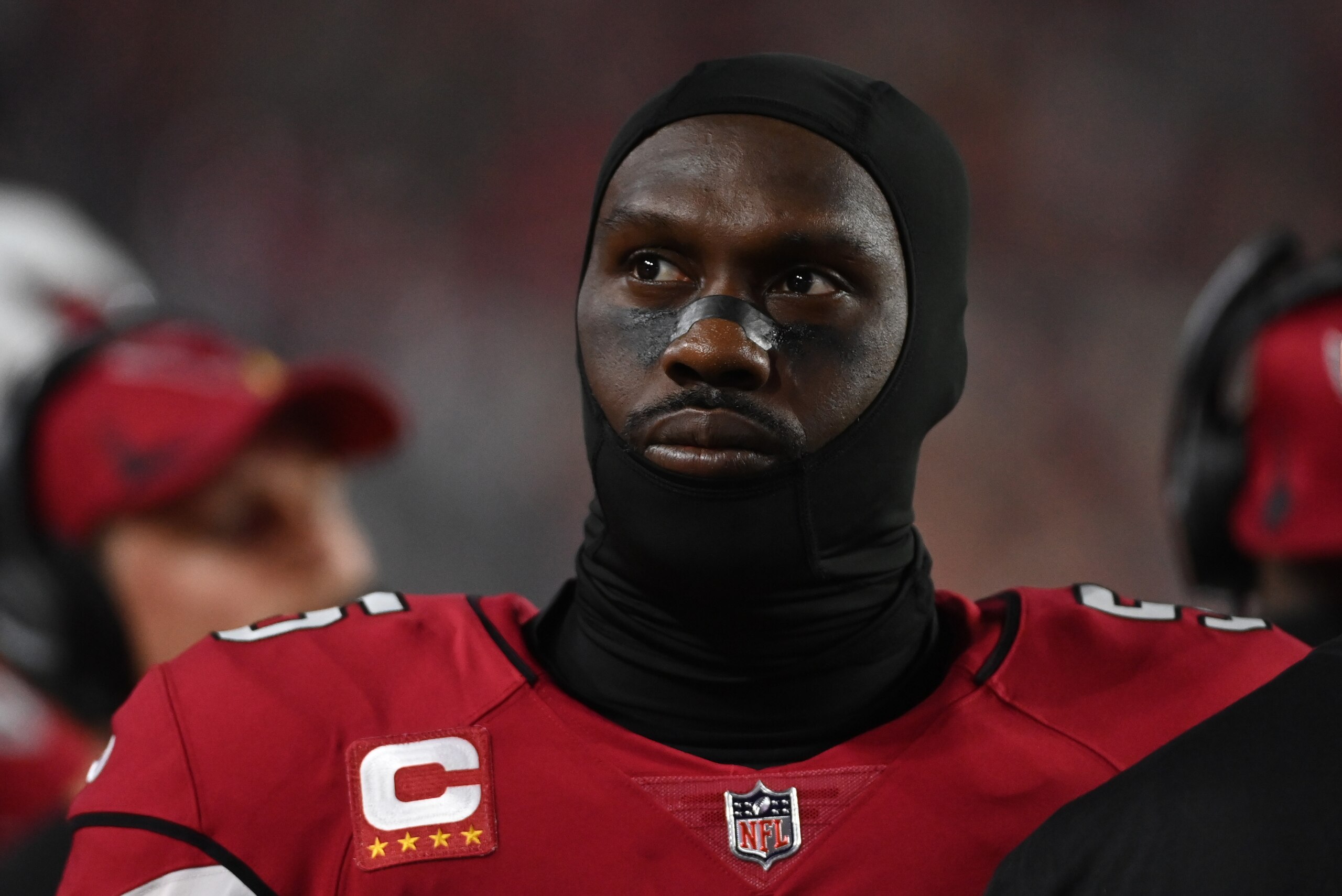 GLENDALE, ARIZONA - DECEMBER 13: Chandler Jones #55 of the Arizona Cardinals looks on from the sidelines during a game against the Los Angeles Rams at State Farm Stadium on December 13, 2021 in Glendale, Arizona. (Photo by Norm Hall/Getty Images)