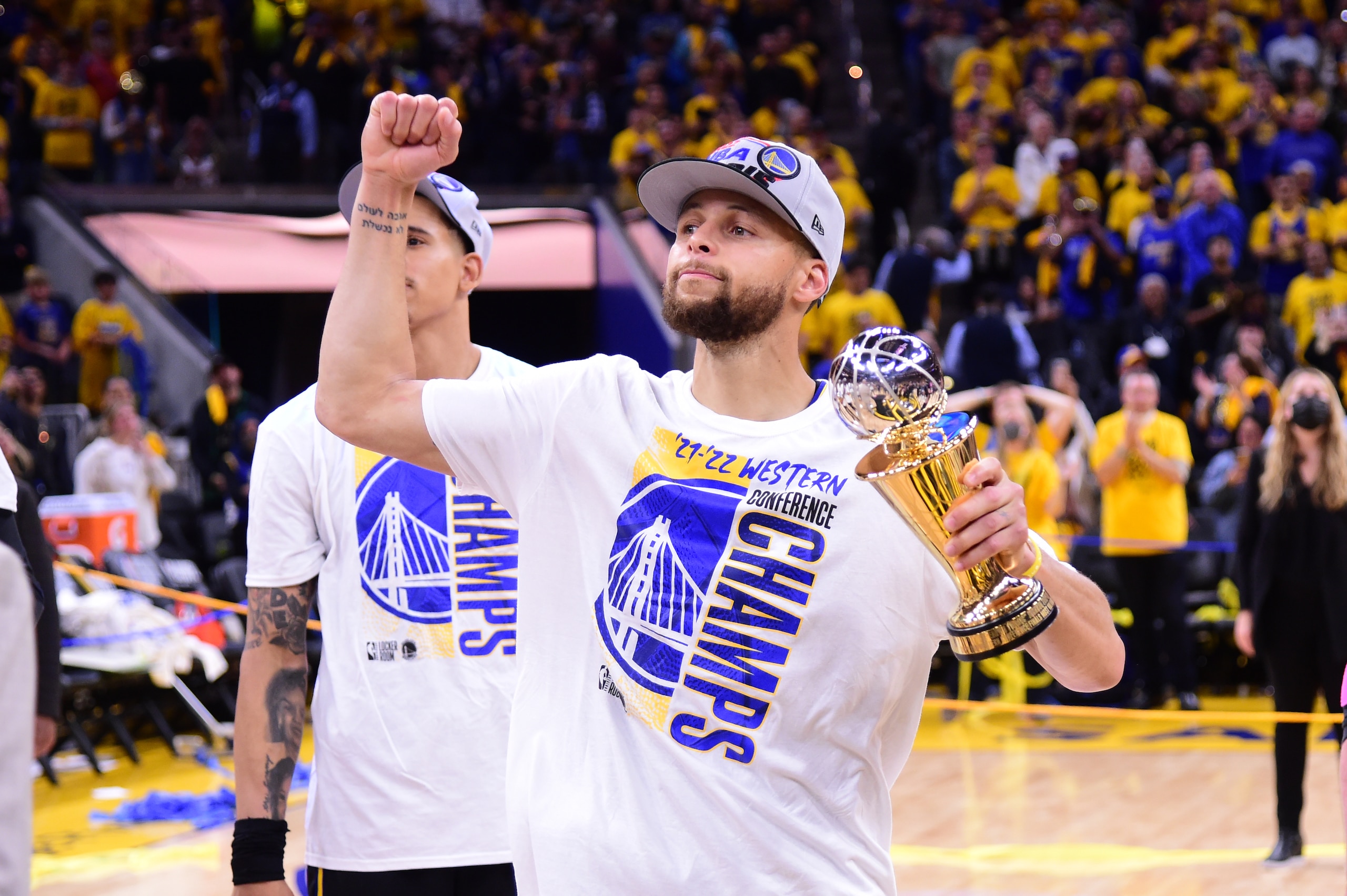 SAN FRANCISCO, CA - MAY 26: Stephen Curry #30 of the Golden State Warriors celebrates after winning the Magic Johnson Western Conference Finals MVP award after Game 5 of the 2022 NBA Playoffs Western Conference Finals on March 26, 2022 at Chase Center in San Francisco, California. NOTE TO USER: User expressly acknowledges and agrees that, by downloading and or using this photograph, user is consenting to the terms and conditions of Getty Images License Agreement. Mandatory Copyright Notice: Copyright 2022 NBAE (Photo by Noah Graham/NBAE via Getty Images)