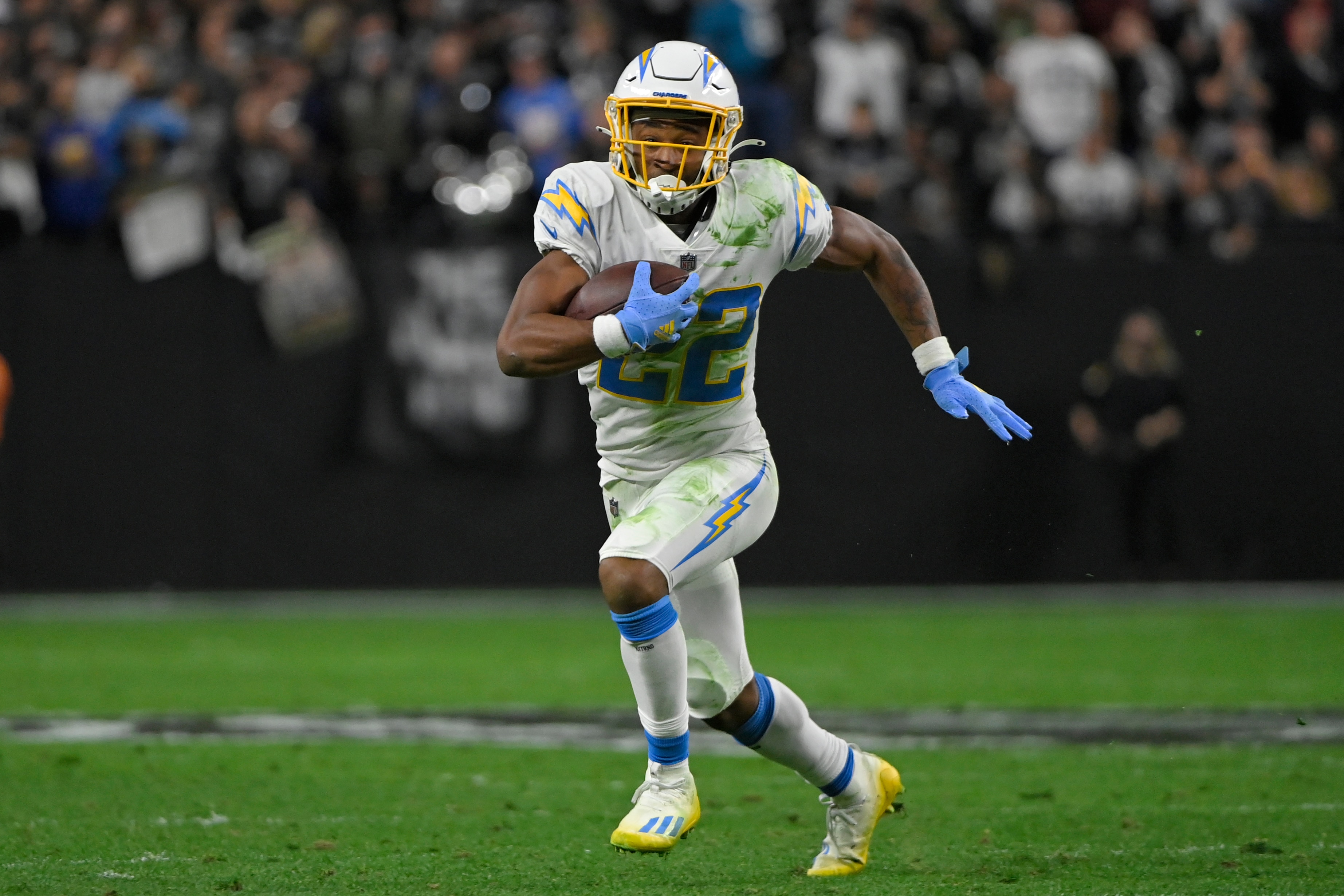 Los Angeles Chargers running back Justin Jackson (22) runs against the Las Vegas Raiders during the first half of an NFL football game, Sunday, Jan. 9, 2022, in Las Vegas. (AP Photo/David Becker)
