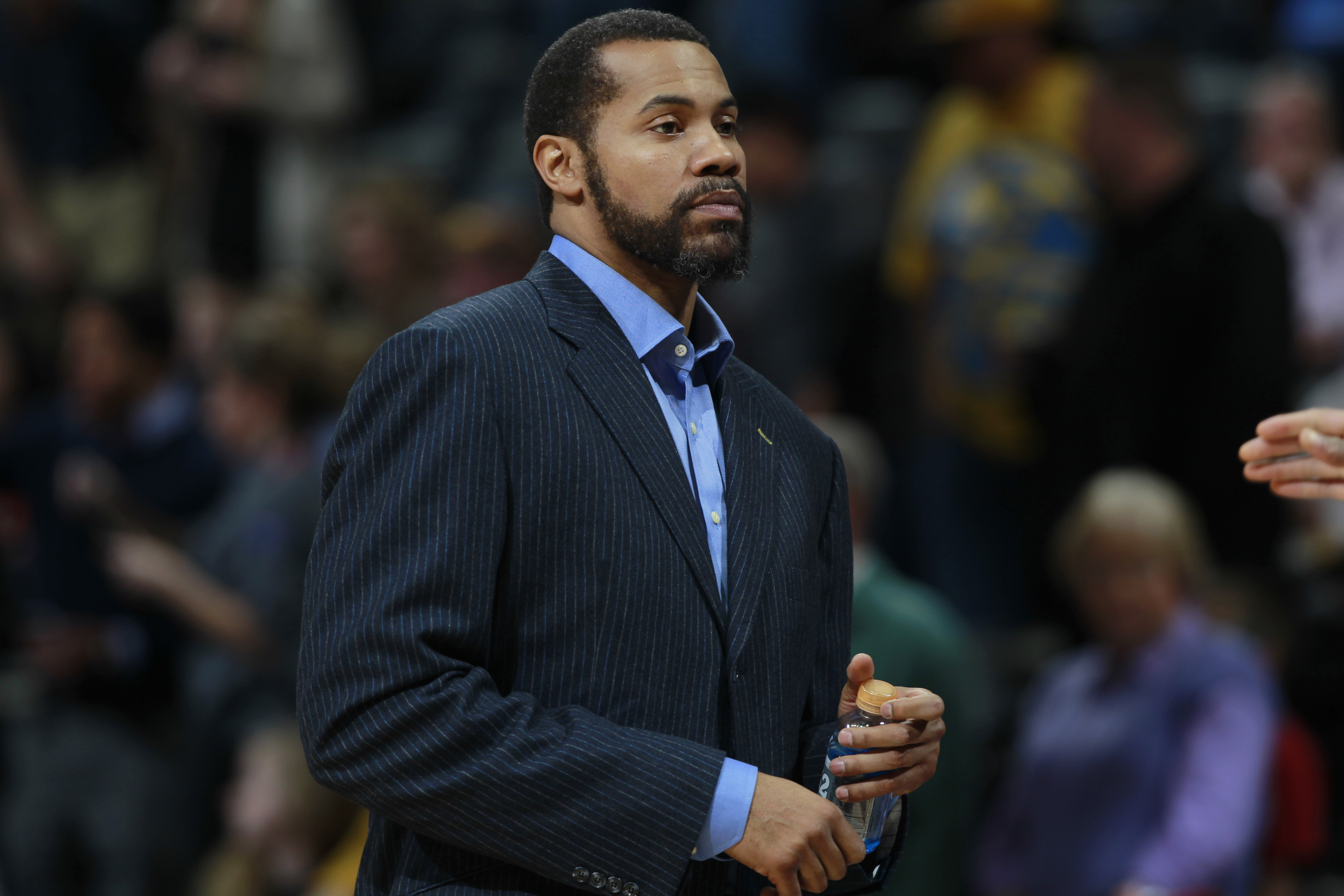 Detroit Pistons assistant coach Rasheed Wallace looks on against the Denver Nuggets in the first quarter of an NBA basketball game in Denver on Wednesday, March 19, 2014. (AP Photo/David Zalubowski)