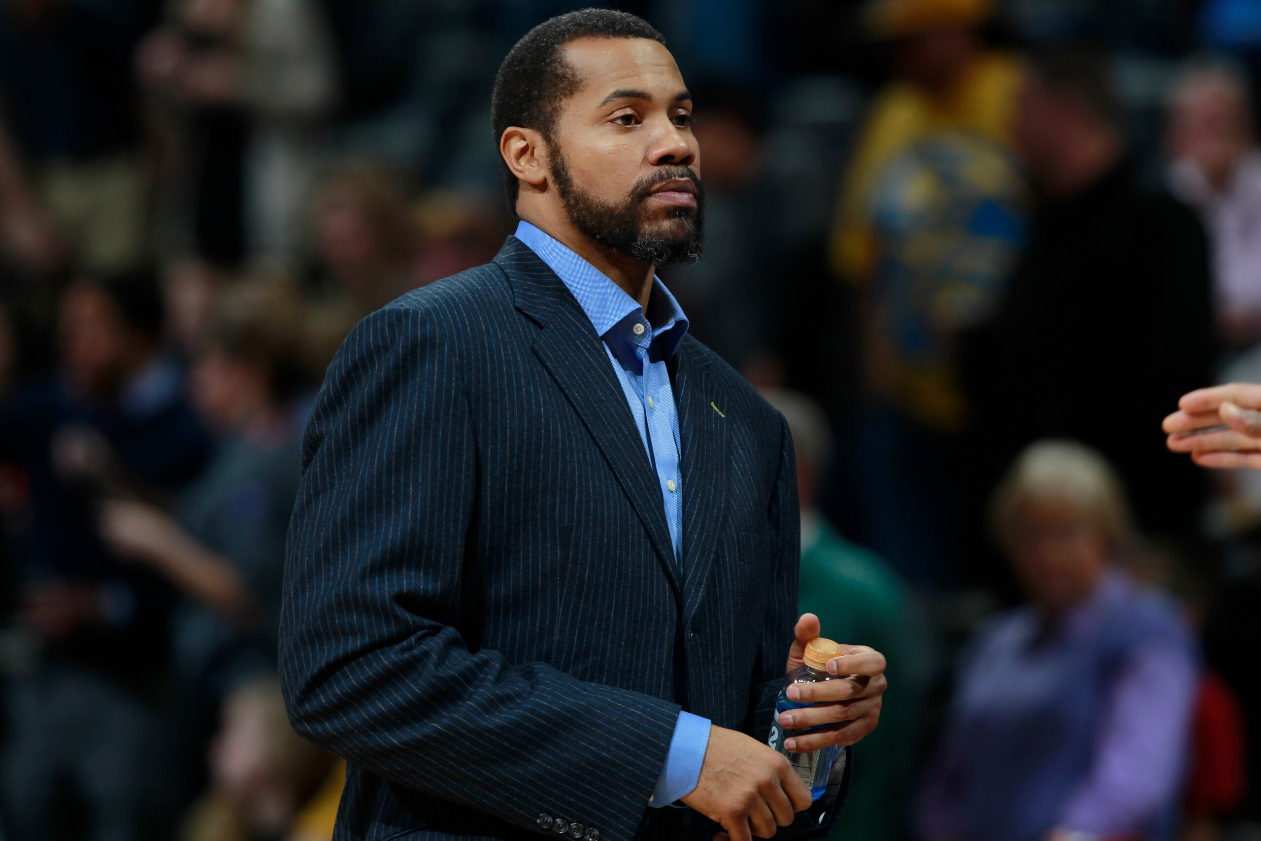 Detroit Pistons assistant coach Rasheed Wallace looks on against the Denver Nuggets in the first quarter of an NBA basketball game in Denver on Wednesday, March 19, 2014. (AP Photo/David Zalubowski)