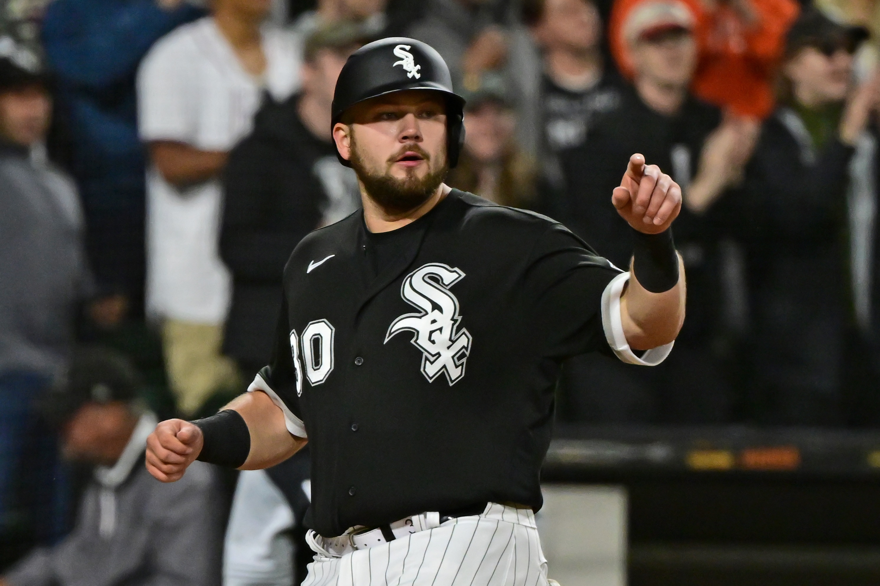 CHICAGO, ILLINOIS - JUNE 07: Jake Burger #30 of the Chicago White Sox reacts after scoring in the sixth inning against the Los Angeles Dodgers at Guaranteed Rate Field on June 07, 2022 in Chicago, Illinois. (Photo by Quinn Harris/Getty Images)