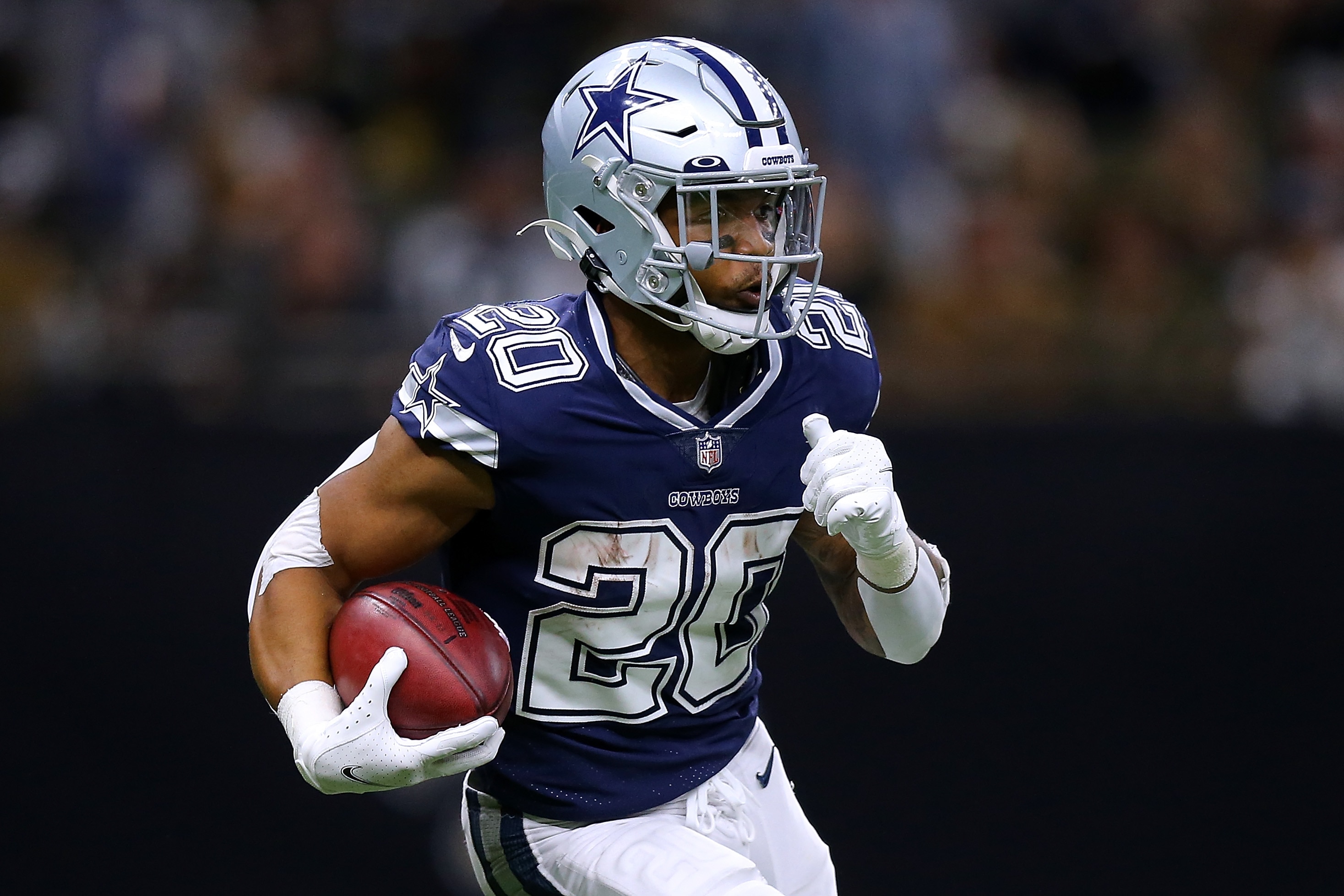 NEW ORLEANS, LOUISIANA - DECEMBER 02: Tony Pollard #20 of the Dallas Cowboys runs with the ball against the New Orleans Saints during a game at the the Caesars Superdome on December 02, 2021 in New Orleans, Louisiana. (Photo by Jonathan Bachman/Getty Images)
