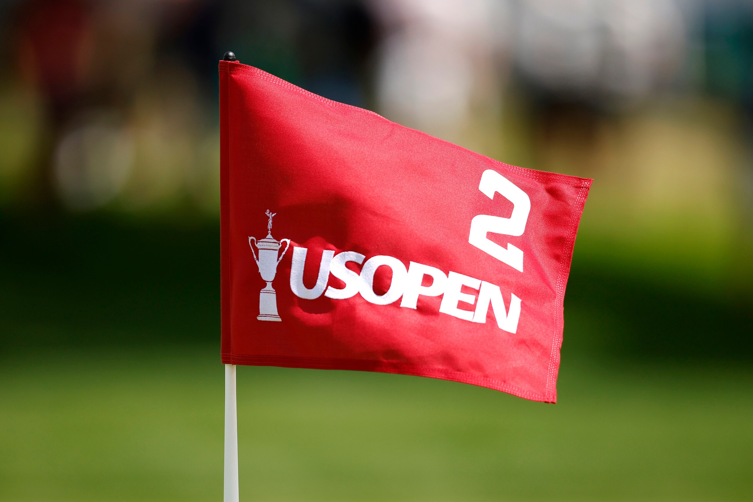 BROOKLINE, MASSACHUSETTS - JUNE 13: A flag blows in the breeze on the second green during a practice round prior to the 2022 U.S. Open at The Country Club on June 13, 2022 in Brookline, Massachusetts. (Photo by Cliff Hawkins/Getty Images) BROOKLINE, MASSACHUSETTS - JUNE 13: A flag blows in the breeze on the second green during a practice round prior to the 2022 U.S. Open at The Country Club on June 13, 2022 in Brookline, Massachusetts. (Photo by Cliff Hawkins/Getty Images)