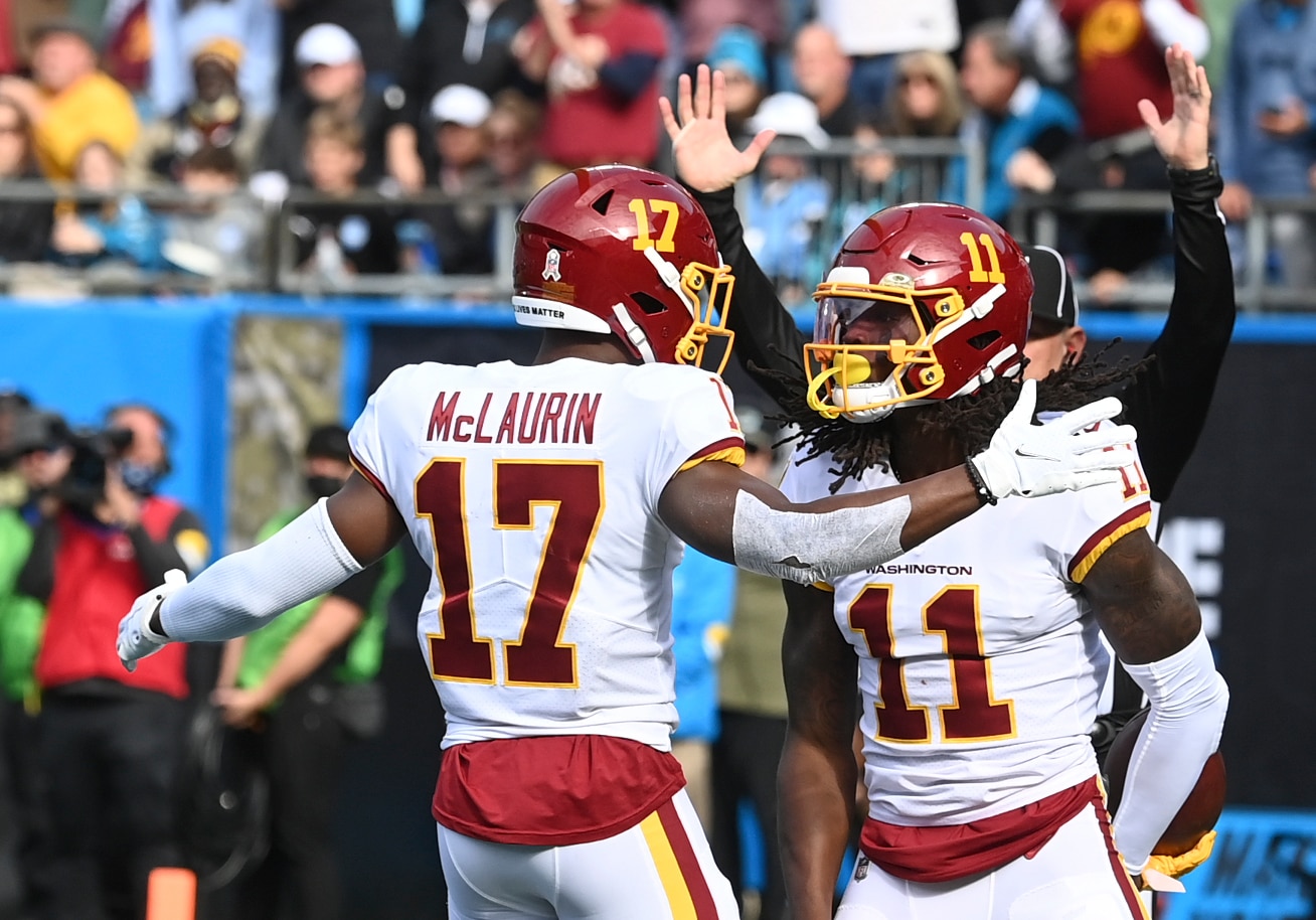 CHARLOTTE, NC - NOVEMBER 21:  Washington Football Team wide receiver Terry McLaurin (17) congratulates Washington Football Team wide receiver Cam Sims (11) after his second quarter touchdown during the game between the Washington Football team and Carolina Panthers at Bank of America Stadium. (Photo by Jonathan Newton/The Washington Post via Getty Images)