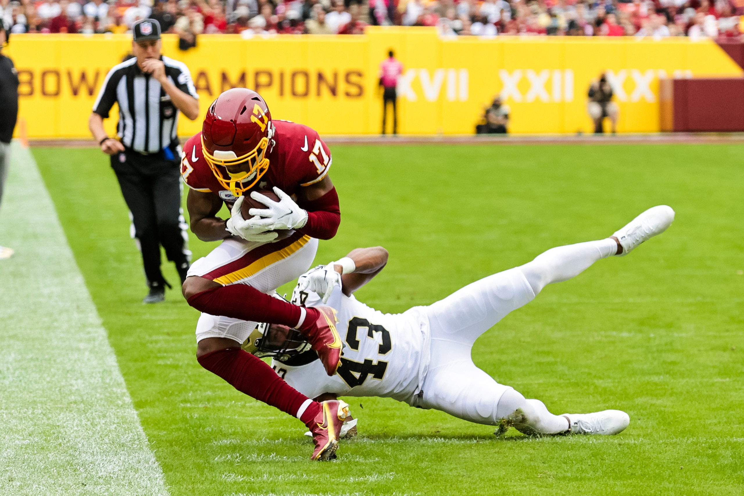 LANDOVER, MD - OCTOBER 10:   Washington Football Team wide receiver Terry McLaurin (17) is tackled out of bounds by New Orleans Saints free safety Marcus Williams (43) during the first half at a NFL game between the Washington Football Team and the New Orleans Saints on October 10, 2021 at the FedExField in Landover, MD. (Photo by Stephen Lew/Icon Sportswire via Getty Images)