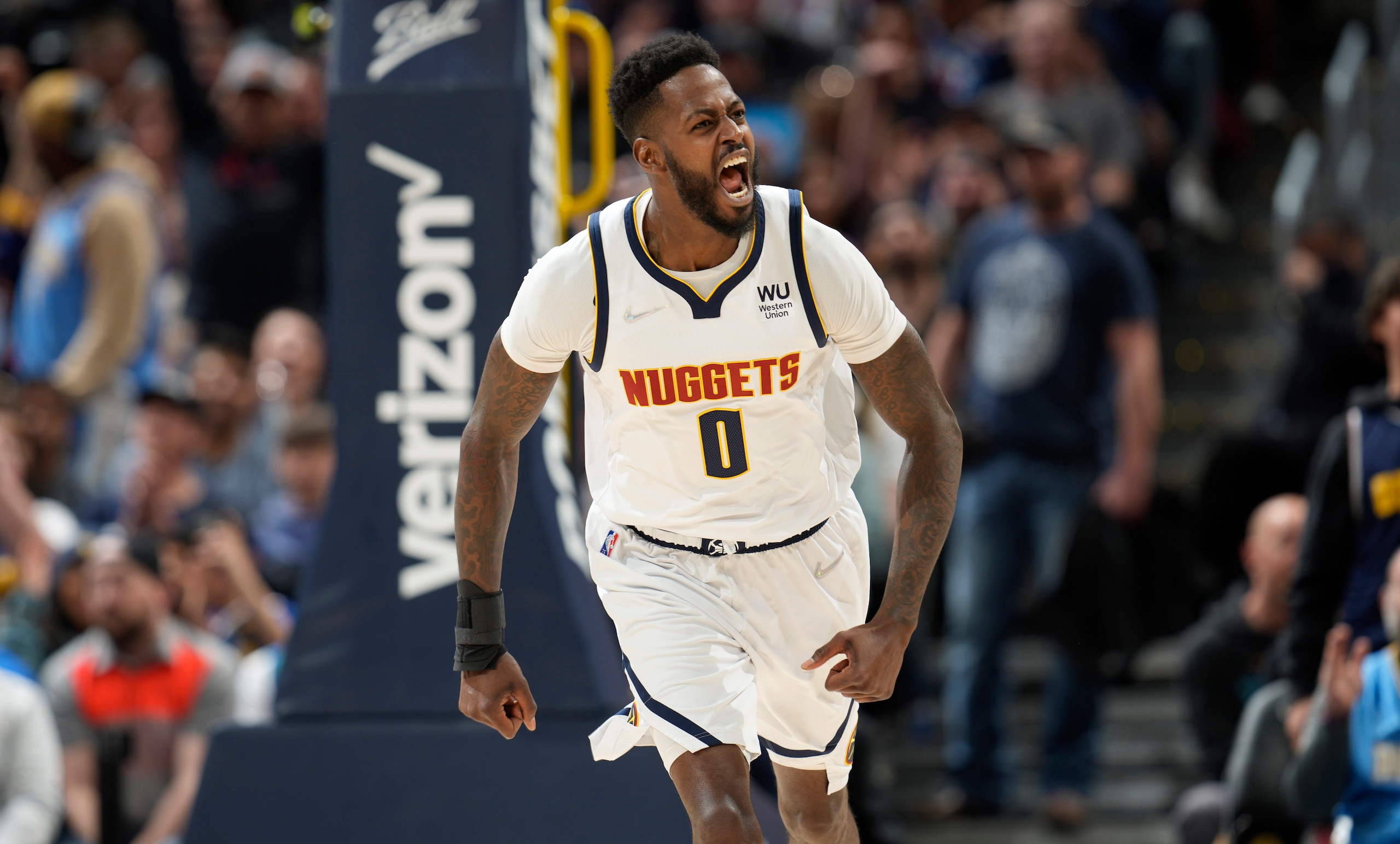 Denver Nuggets forward JaMychal Green reacts after dunking against the Minnesota Timberwolves in the first half of an NBA basketball game Friday, April 1, 2022, in Denver. (AP Photo/David Zalubowski)