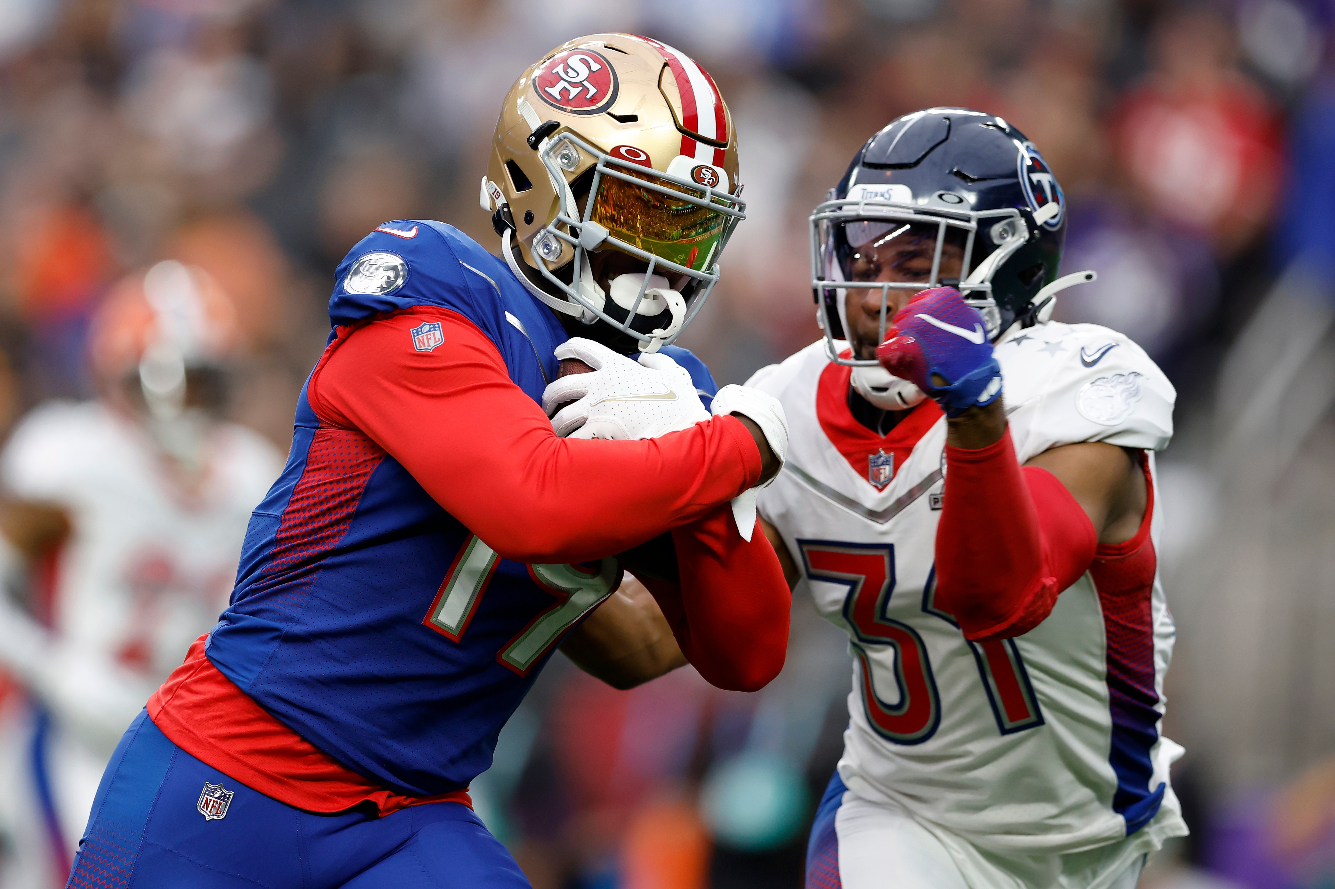 LAS VEGAS, NEVADA - FEBRUARY 06: Deebo Samuel #19 of the San Francisco 49ers and NFC runs with the ball as Kevin Byard #31 of the Tennessee Titans and AFC defends during the 2022 NFL Pro Bowl at Allegiant Stadium on February 06, 2022 in Las Vegas, Nevada. (Photo by Christian Petersen/Getty Images)