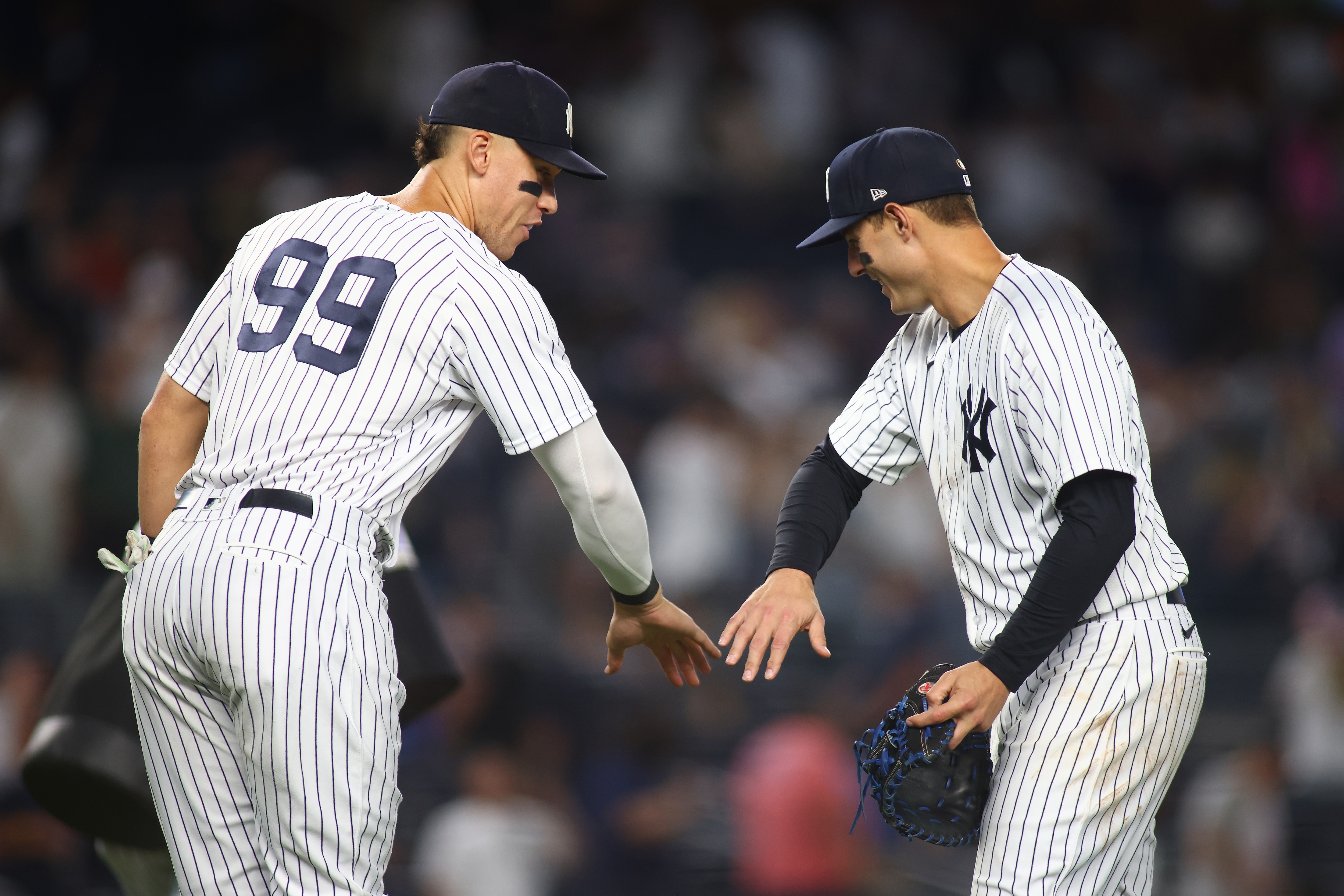 NEW YORK, NEW YORK - JUNE 11: Aaron Judge #99 and Anthony Rizzo #48 of the New York Yankees celebrate after defeating the Chicago Cubs 8-0 at Yankee Stadium on June 11, 2022 in New York City. (Photo by Mike Stobe/Getty Images)