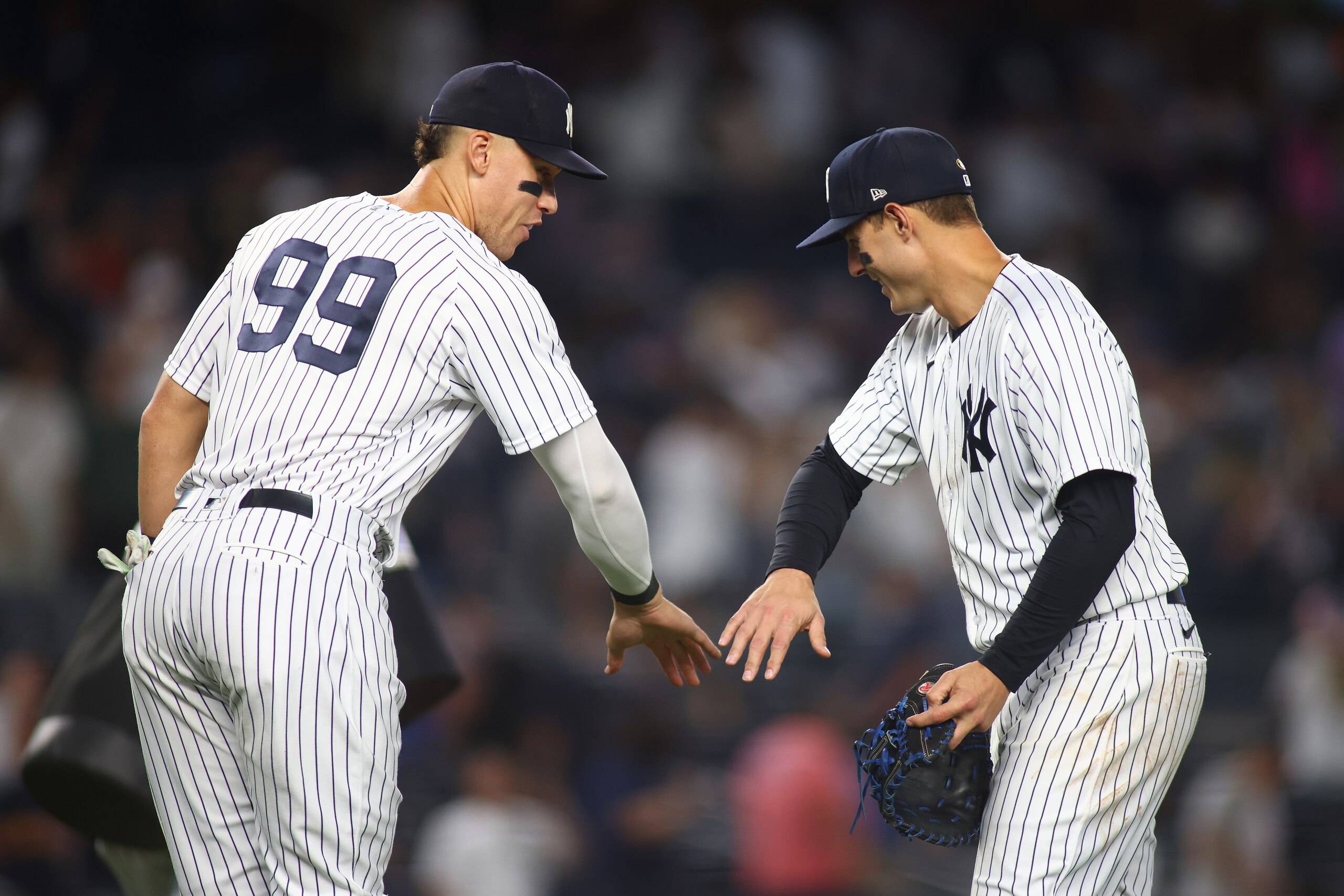 NEW YORK, NEW YORK - JUNE 11: Aaron Judge #99 and Anthony Rizzo #48 of the New York Yankees celebrate after defeating the Chicago Cubs 8-0 at Yankee Stadium on June 11, 2022 in New York City. (Photo by Mike Stobe/Getty Images)