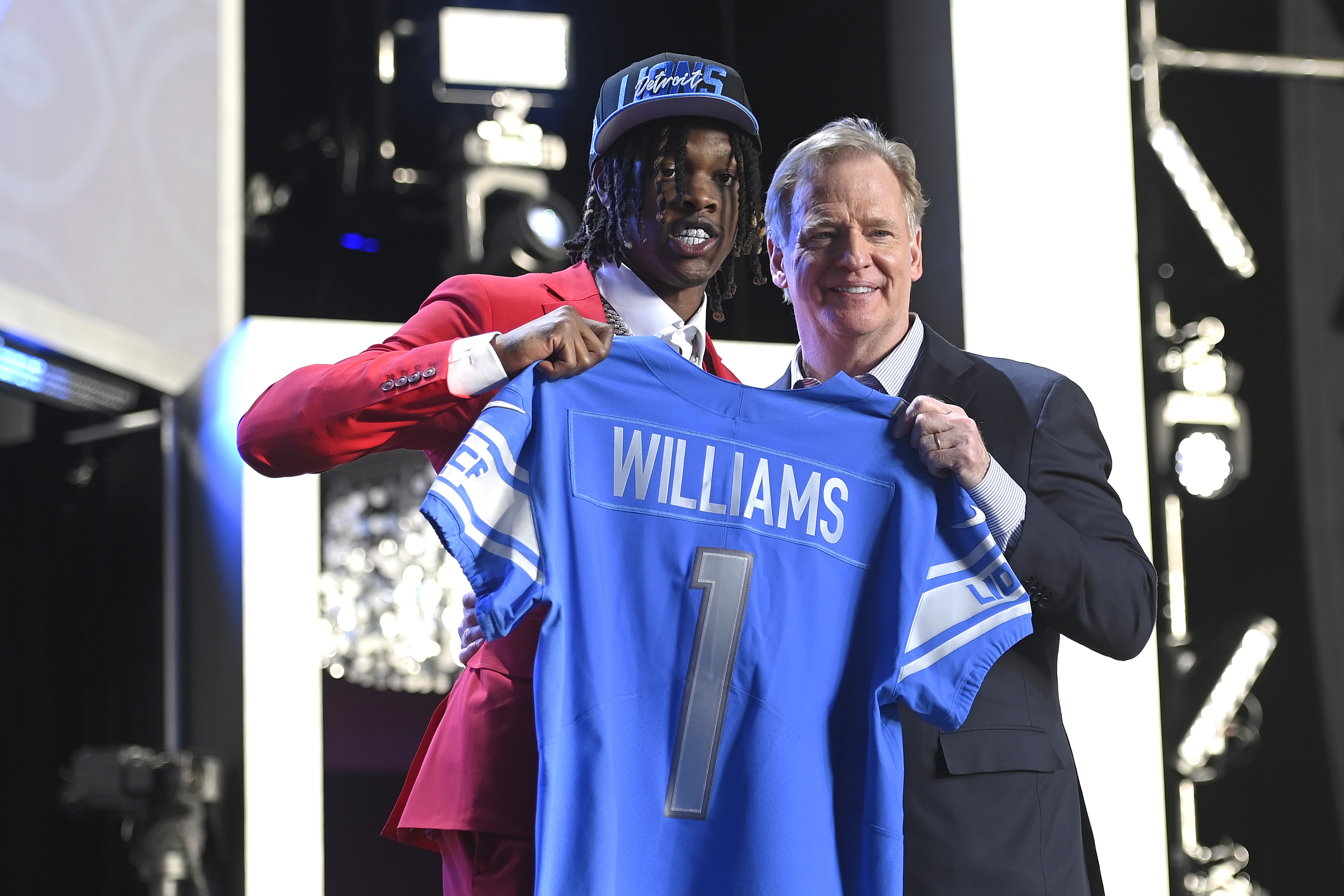 LAS VEGAS, NEVADA - APRIL 28: (L-R) Jameson Williams poses with NFL Commissioner Roger Goodell onstage after being selected 12th by the Detroit Lions during round one of the 2022 NFL Draft on April 28, 2022 in Las Vegas, Nevada. (Photo by David Becker/Getty Images)